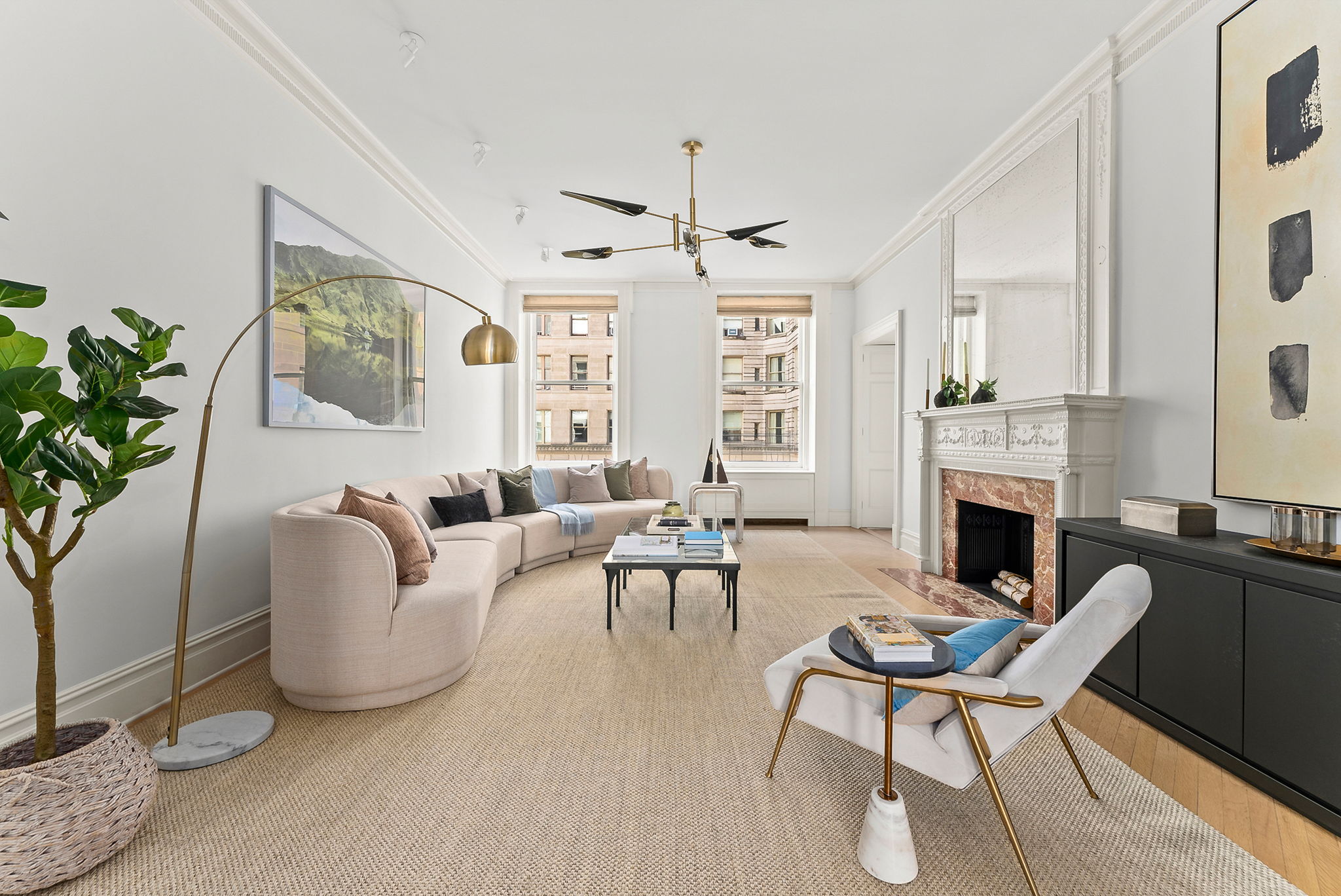 390 West End Avenue, Unit 4J Manhattan, NY 10024 - Photo 2 of 17 a living room with furniture a fireplace and a potted plant