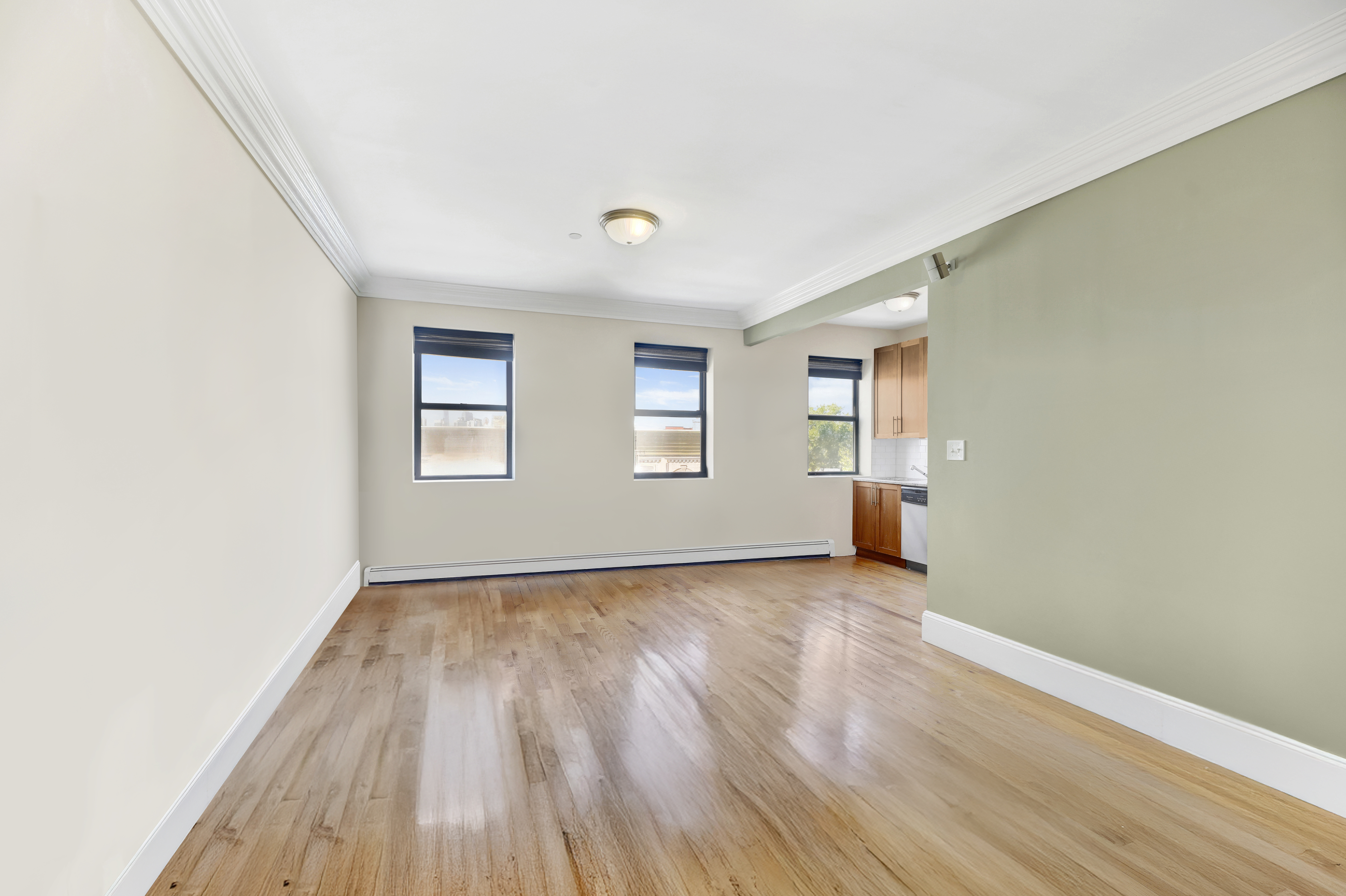 36 Russell Street, Unit 22 Brooklyn, NY 11222 - Photo 2 of 27 an empty room with wooden floor and windows