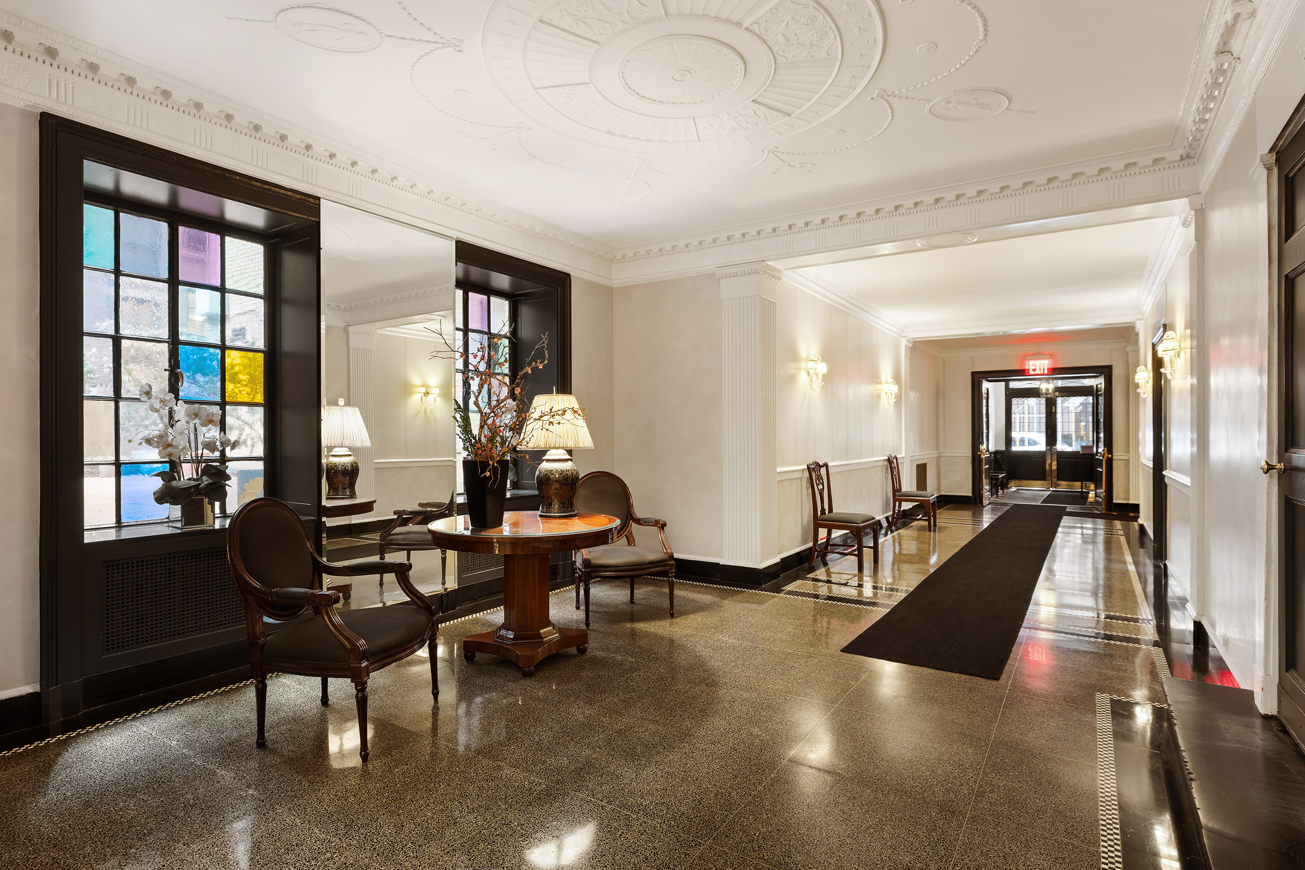 130 East 75th Street, Unit 4D Manhattan, NY 10021 - Photo 17 of 19 a living room with furniture pool table and large windows