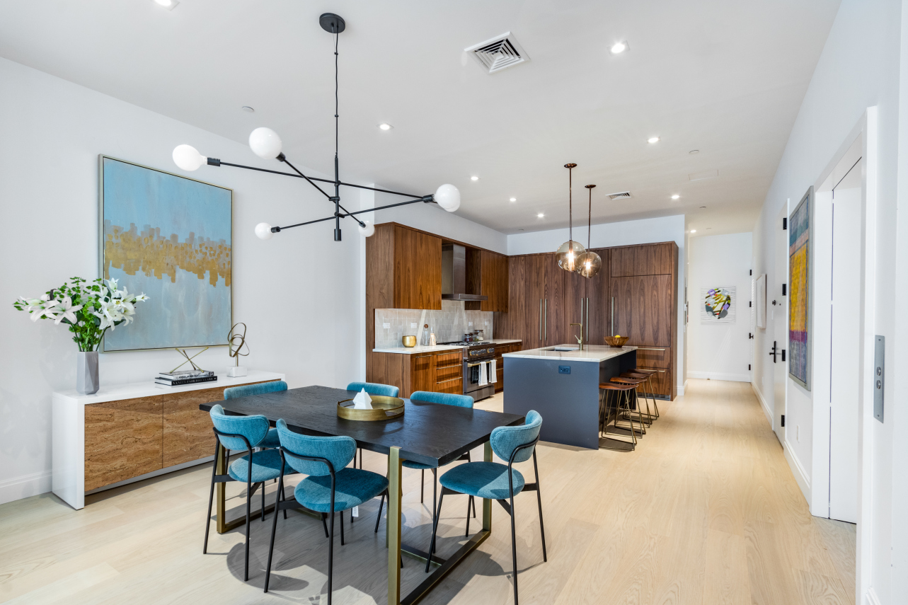 106 Franklin Street, Unit PH Manhattan, NY 10013 - Photo 4 of 13 a kitchen with a table and chairs in it