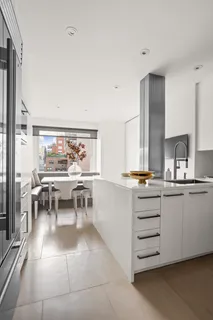 a kitchen with stainless steel appliances a sink and cabinets