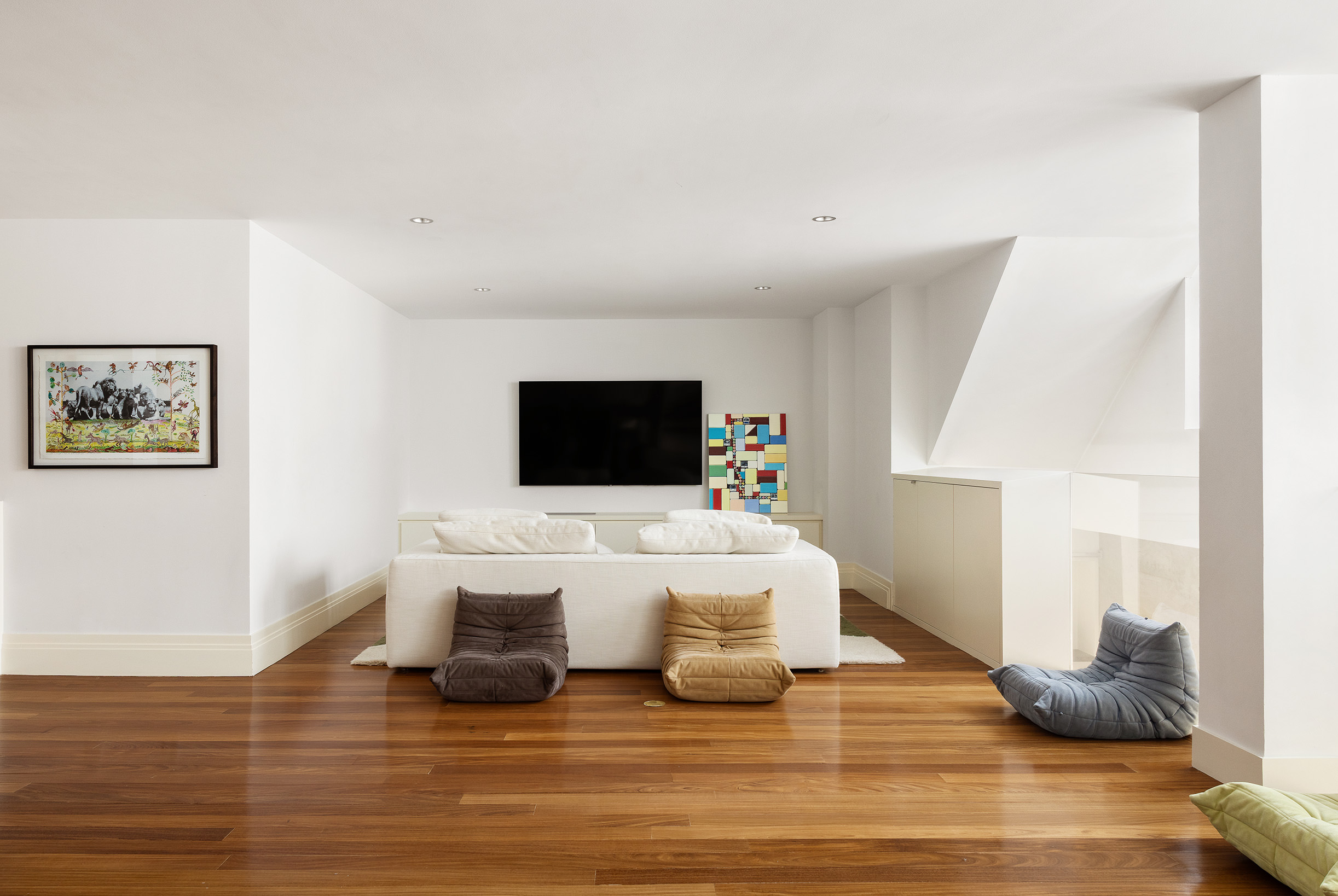 27 North Moore Street, Unit 10D Manhattan, NY 10013 - Photo 25 of 30 a living room with furniture and a flat screen tv