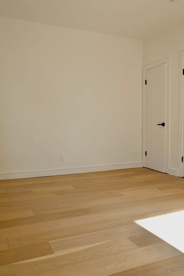 a view of an empty room and window