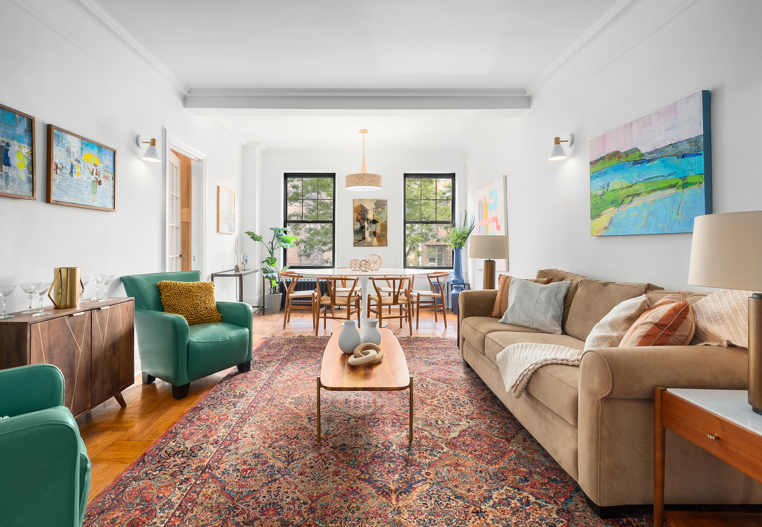 170 2nd Avenue, Unit 2D Manhattan, NY 10003 - Photo 1 of 11 a living room with furniture and a large window