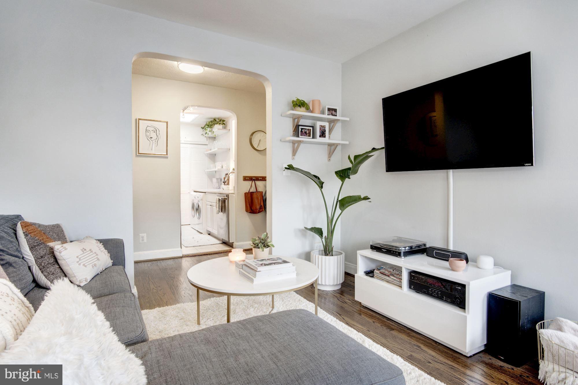 731 13th Street Northeast Washington, DC 20002 - Photo 14 of 43 a living room with furniture and a flat screen tv