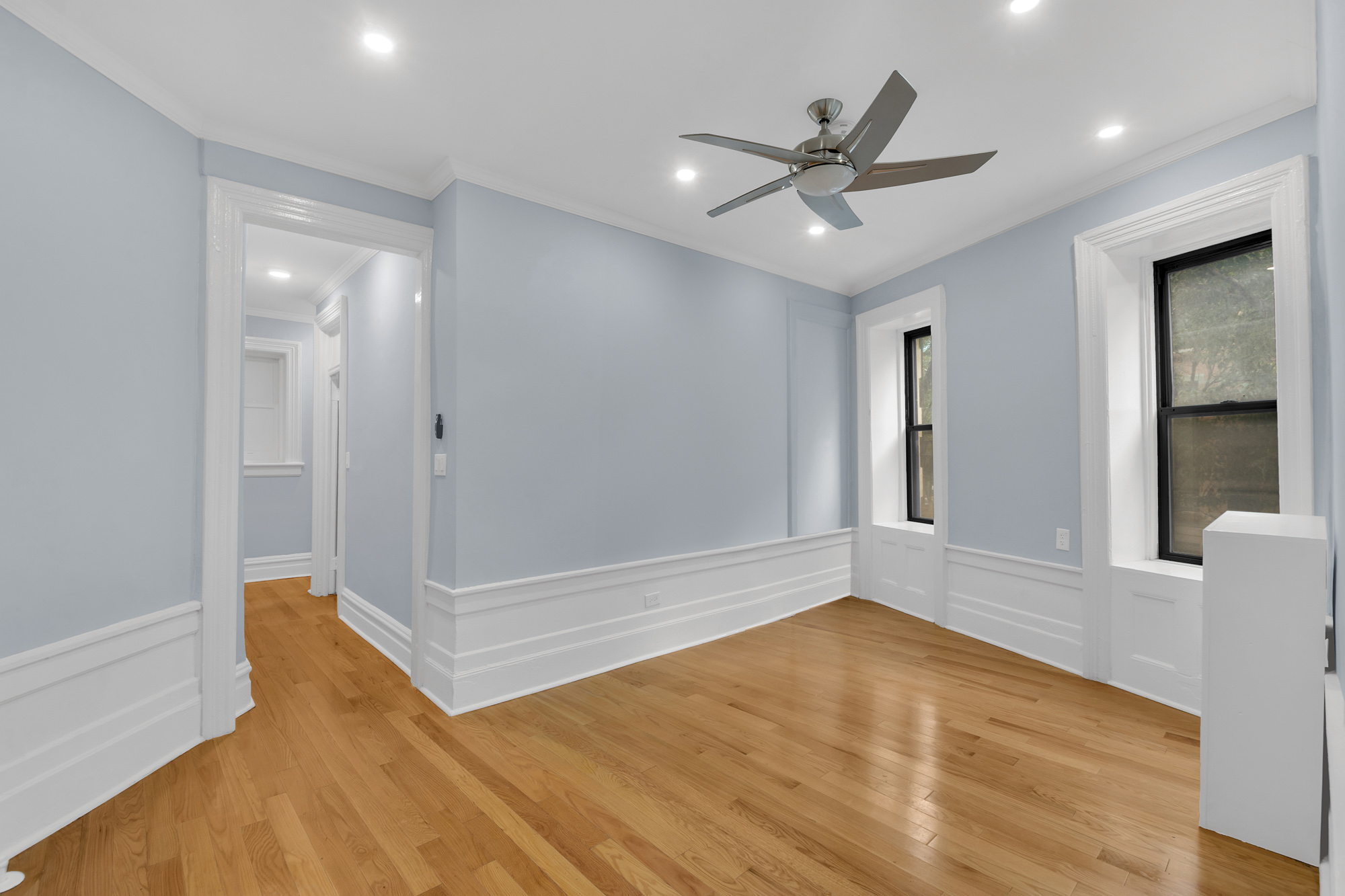100 Hamilton Place, Unit 2F Manhattan, NY 10031 - Photo 9 of 21 wooden floor in an empty room with a window