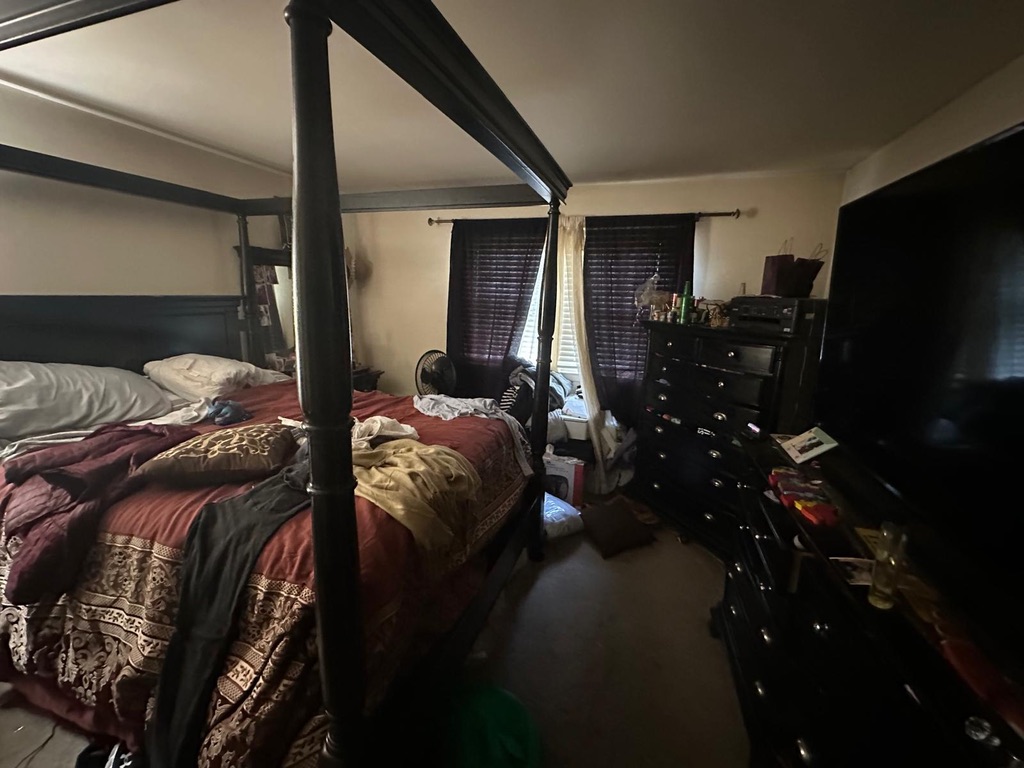 713 Willow Street, Unit 2A Lansdale, PA 19446 - Photo 12 of 15 a bed room with a bed and a television