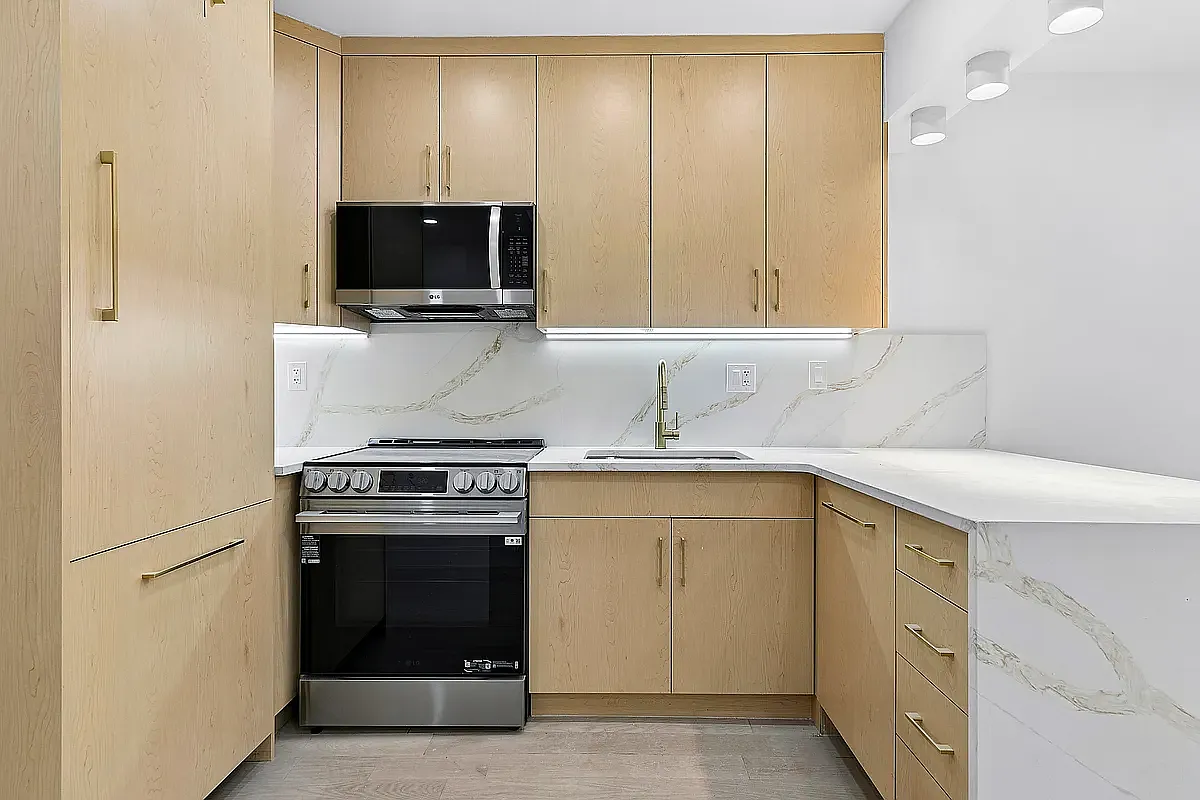 452 Dean Street, Unit 2F Brooklyn, NY 11217 - Photo 3 of 8 a kitchen with a stove and a sink