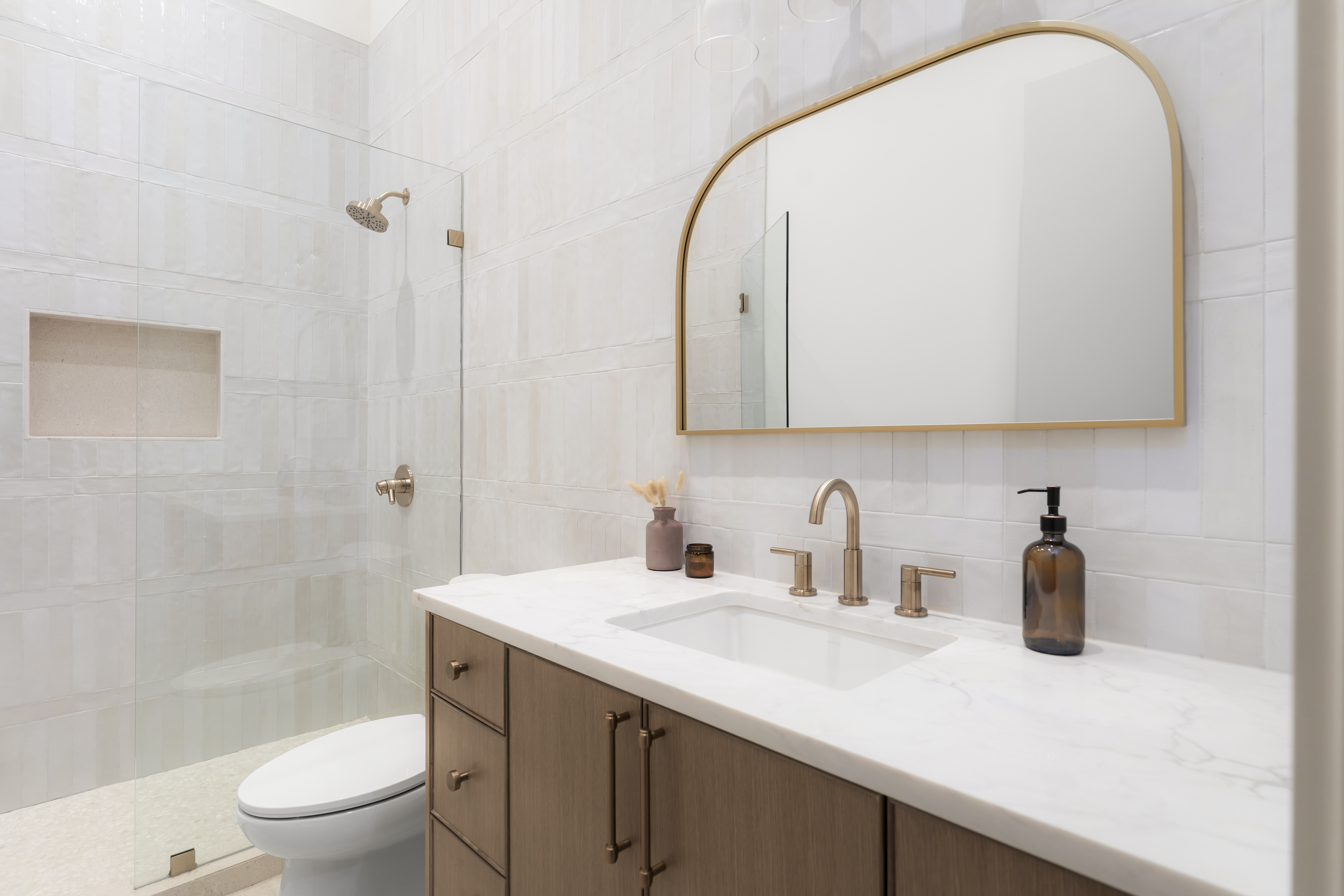 3411 Bridle Path Austin, TX 78703 - Photo 42 of 76 a bathroom with a sink a toilet and a mirror