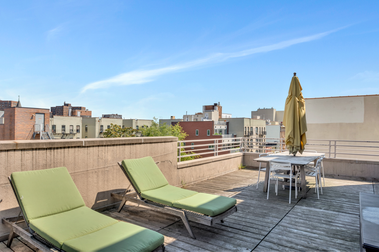 416 East 117th Street, Unit PH6 Manhattan, NY 10035 - Photo 15 of 20 a view of a terrace with chairs