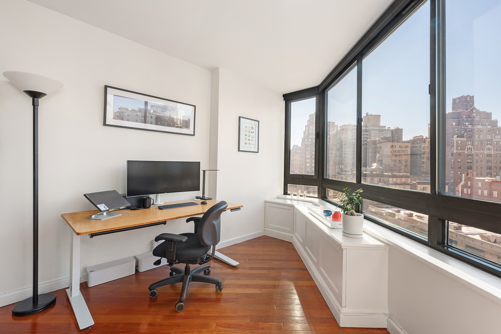 225 West 83rd Street, Unit 8L Manhattan, NY 10024 - Photo 3 of 18 a view of a workspace with furniture and a window
