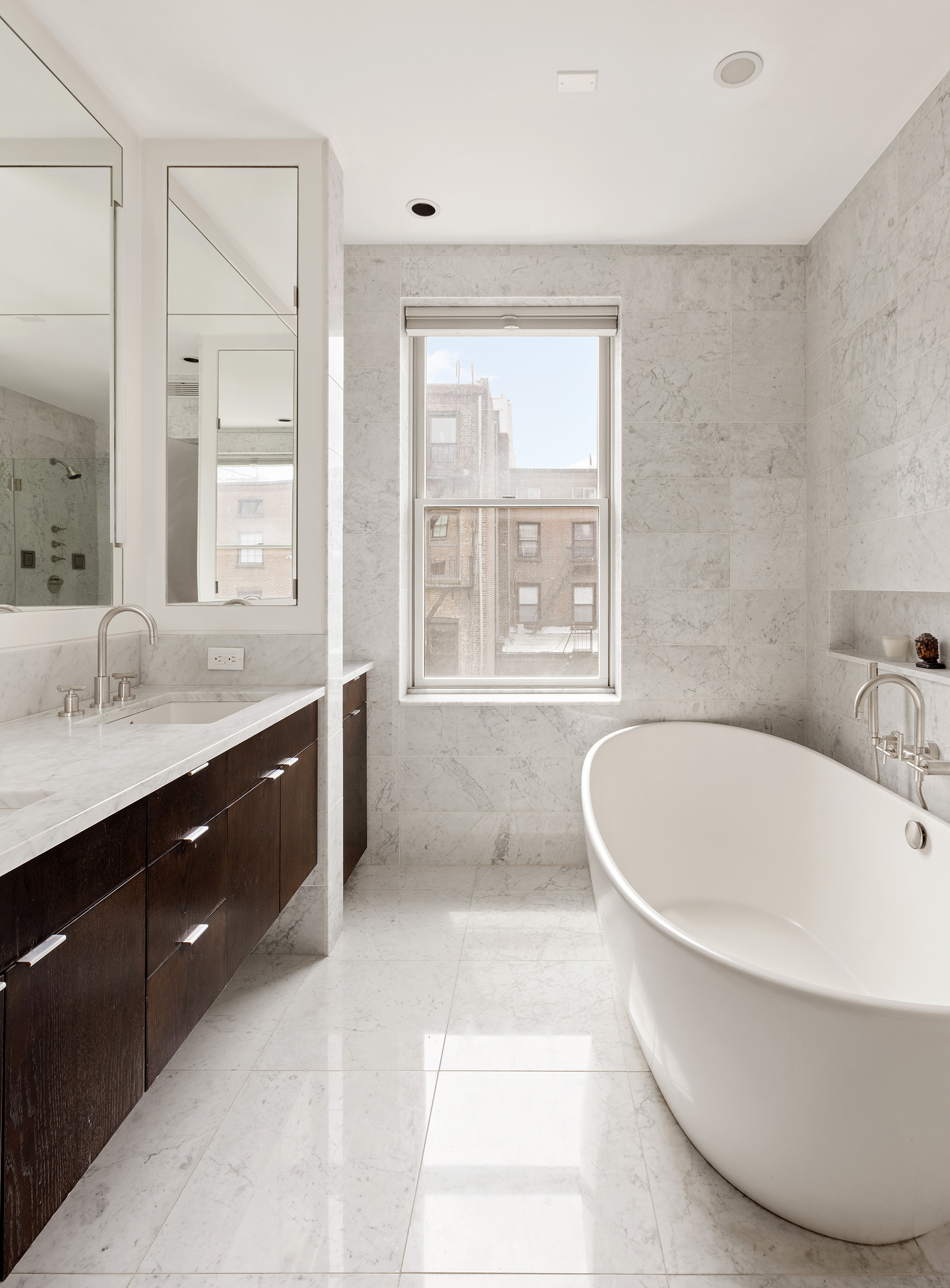 126 Pacific Street Brooklyn, NY 11201 - Photo 7 of 16 a bathroom with a tub sink double vanity and window