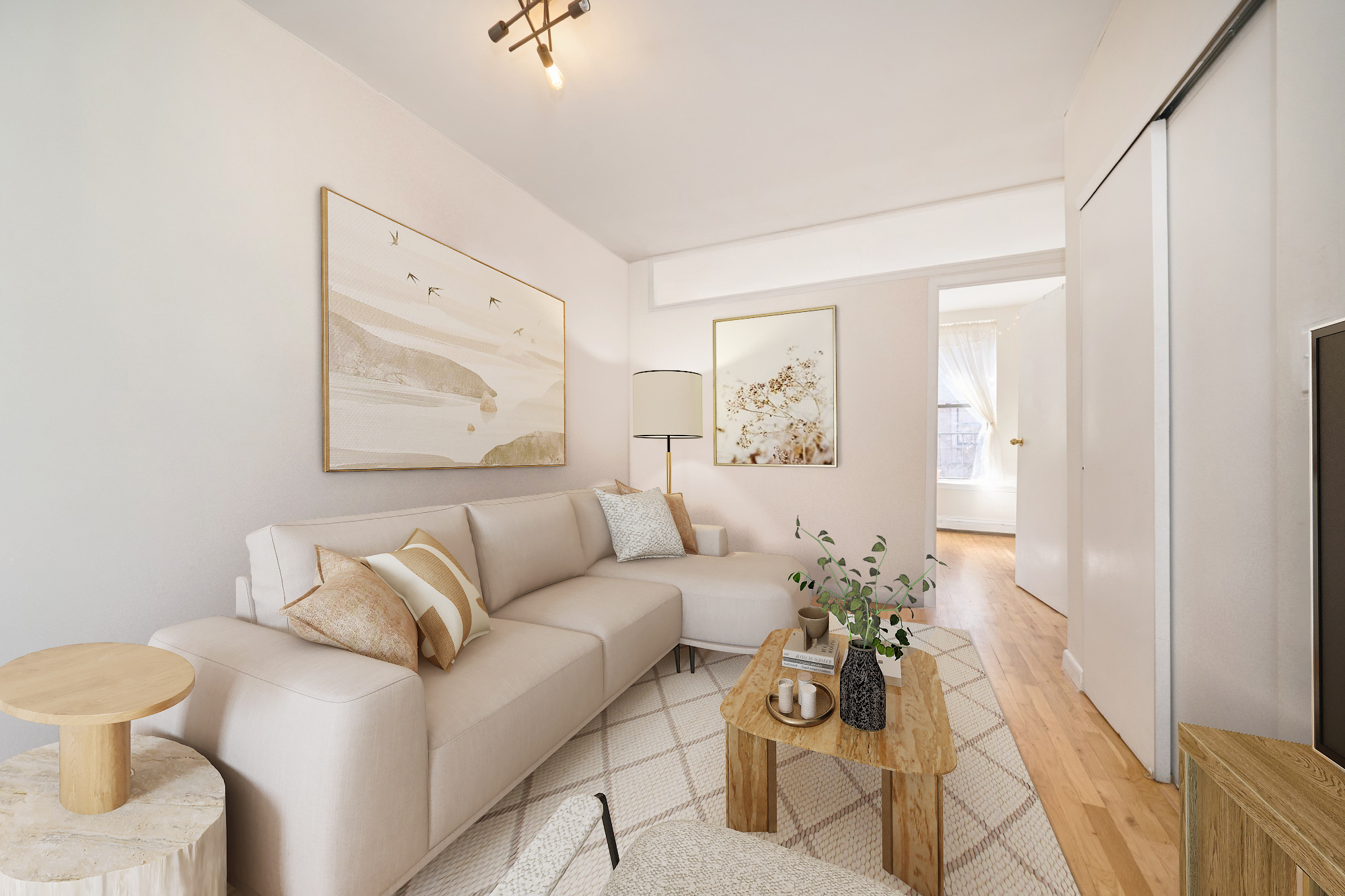 a living room with furniture and wooden floor