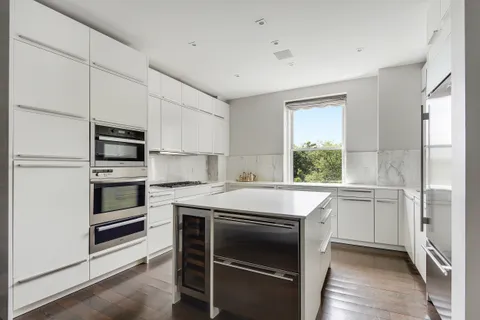 a kitchen with a stove oven and a refrigerator