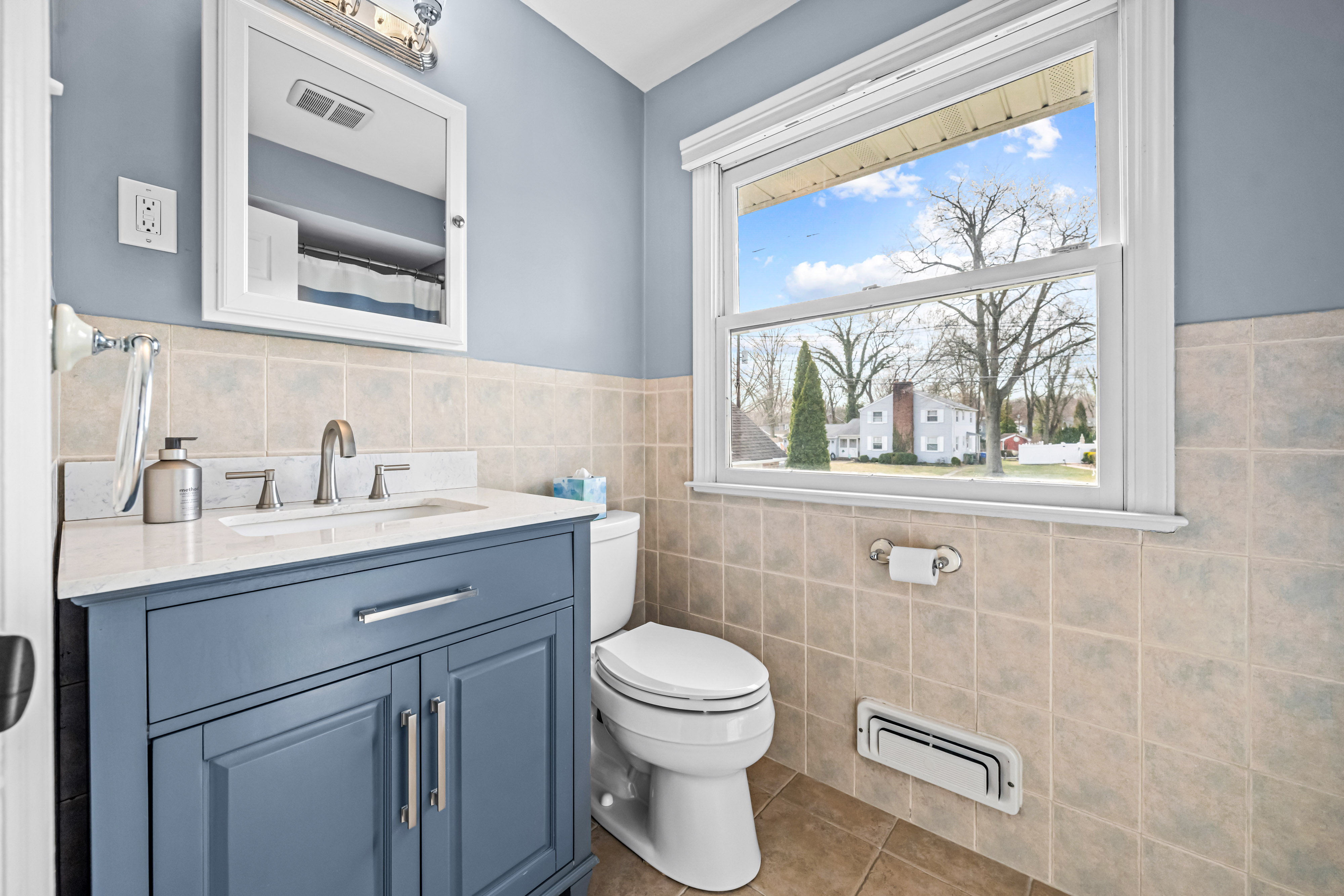 430 Pelham Road Cherry Hill, NJ 08034 - Photo 42 of 48 a bathroom with a toilet a sink a mirror and a window