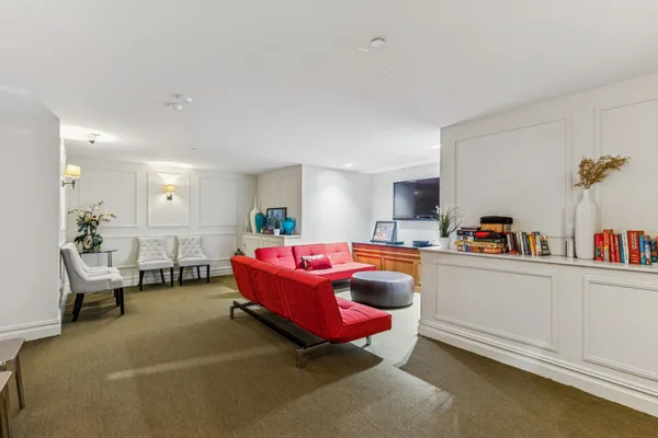 a bedroom with furniture and a chandelier