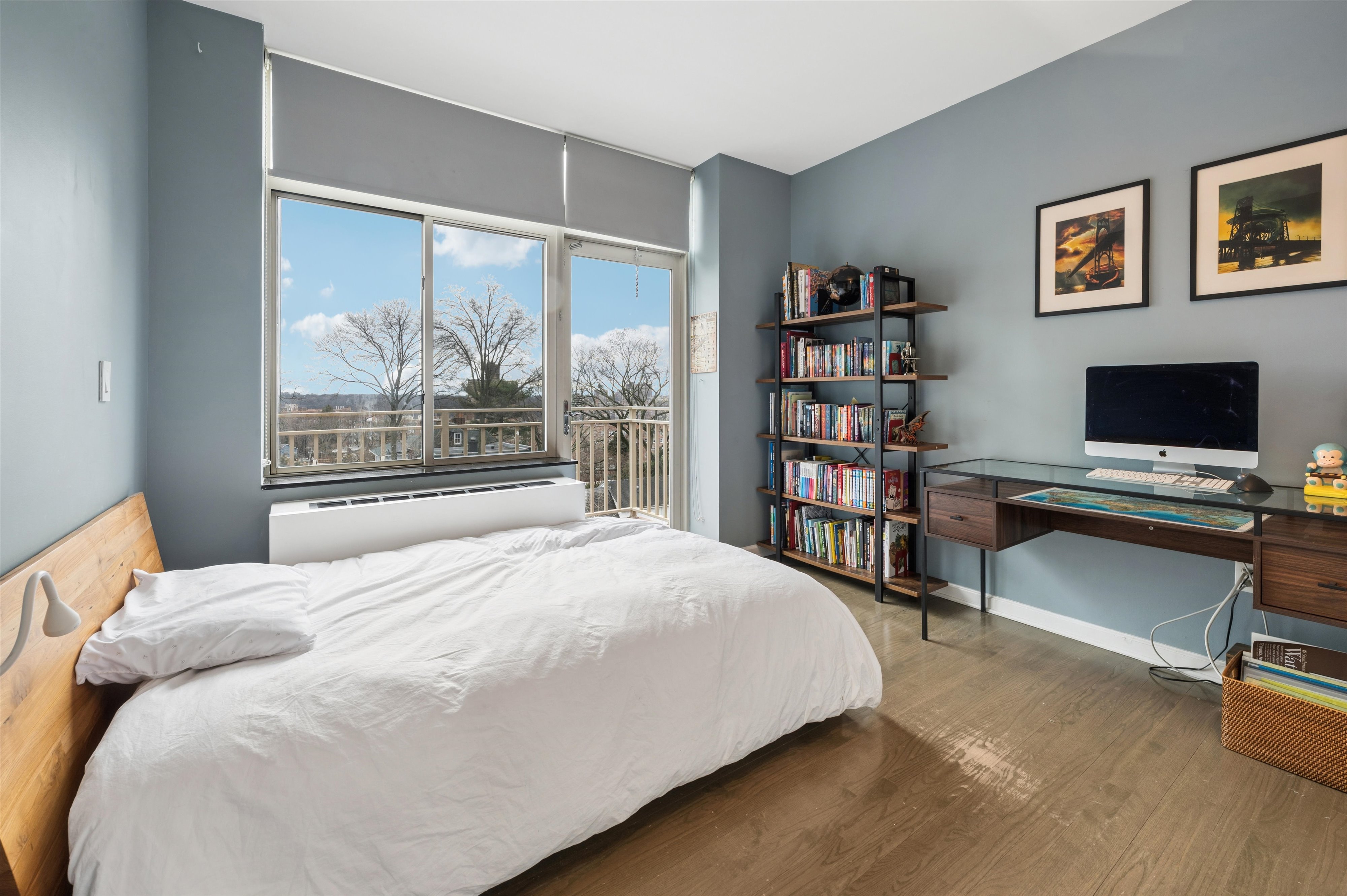 3625 Oxford Avenue, Unit 7C Bronx, NY 10463 - Photo 15 of 20 a bedroom with a bed and a large window