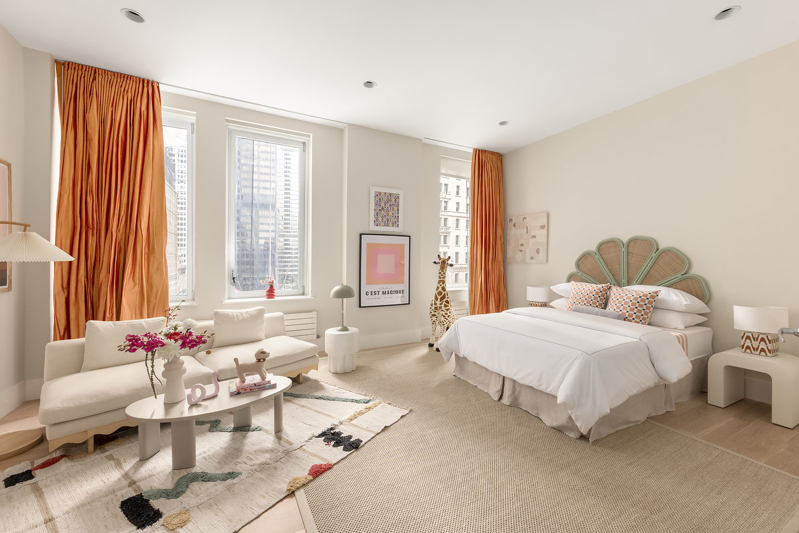 114 Liberty Street, Unit 7 Manhattan, NY 10006 - Photo 11 of 15 a spacious bedroom with a bed and a couch