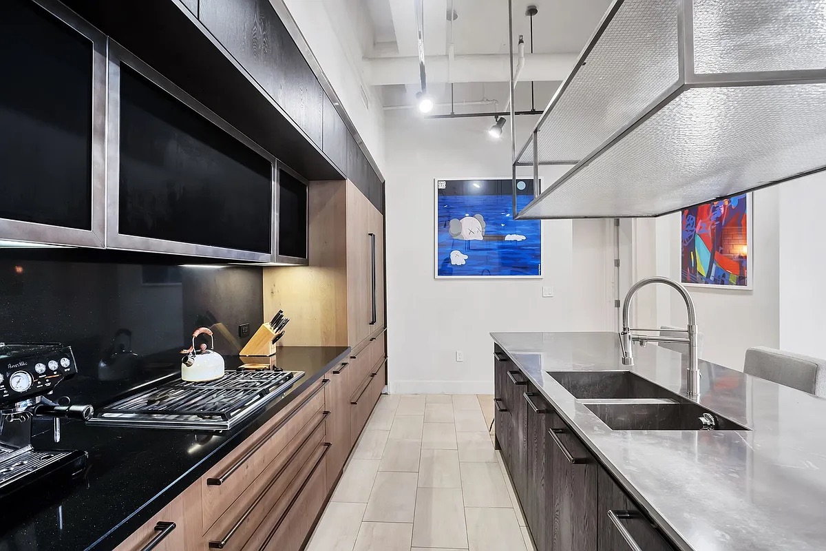 360 Furman Street, Unit 202 Brooklyn, NY 11201 - Photo 5 of 55 a kitchen with a stove and a sink