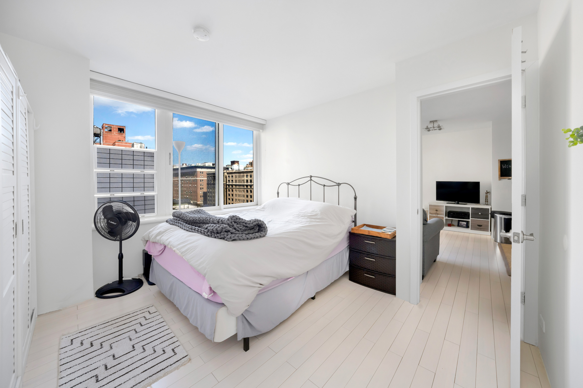 2373 Broadway, Unit 1425 Manhattan, NY 10024 - Photo 6 of 13 a bedroom with a bed and a television