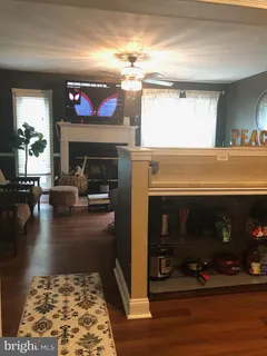 a kitchen with a refrigerator and microwave
