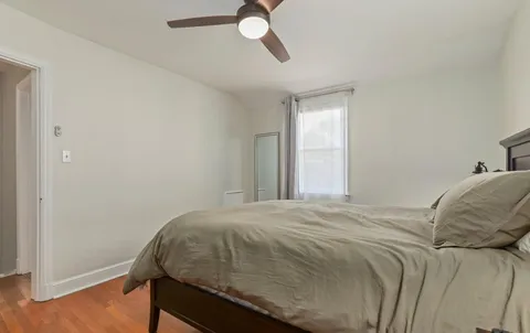 a bedroom with a bed and cabinets