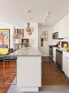 a kitchen with stainless steel appliances granite countertop a sink and stove