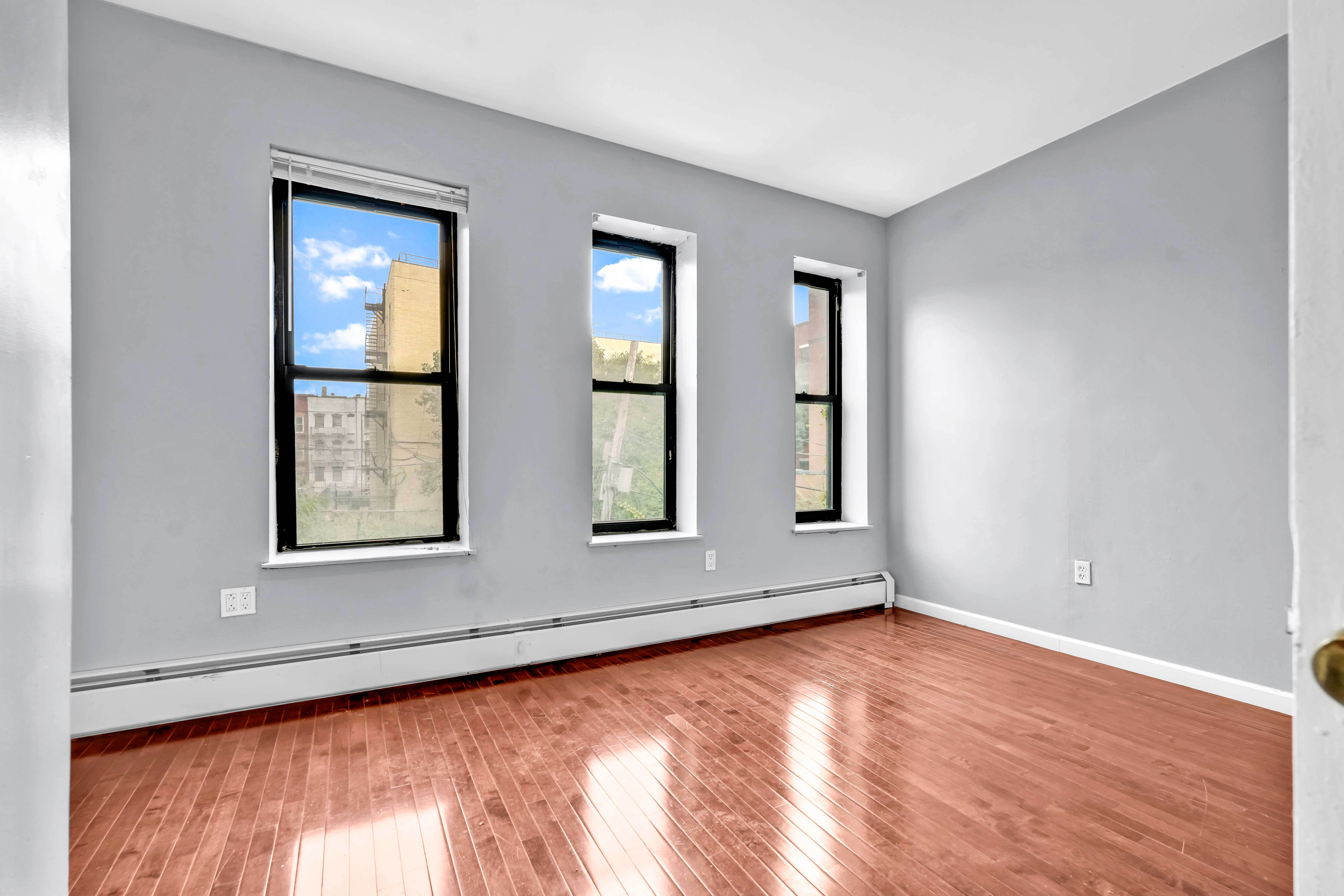 1633 St Johns Place, Unit 3 Brooklyn, NY 11233 - Photo 9 of 29 an empty room with window