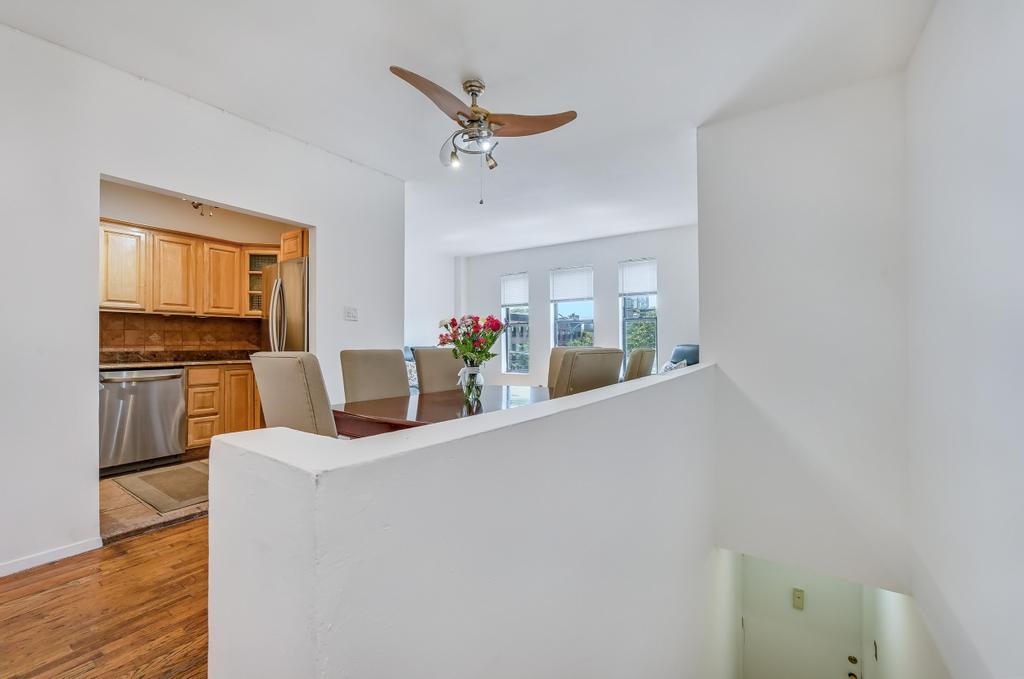 57 Carroll Street, Unit 38A Brooklyn, NY 11231 - Photo 4 of 21 a view of kitchen with furniture and wooden floor