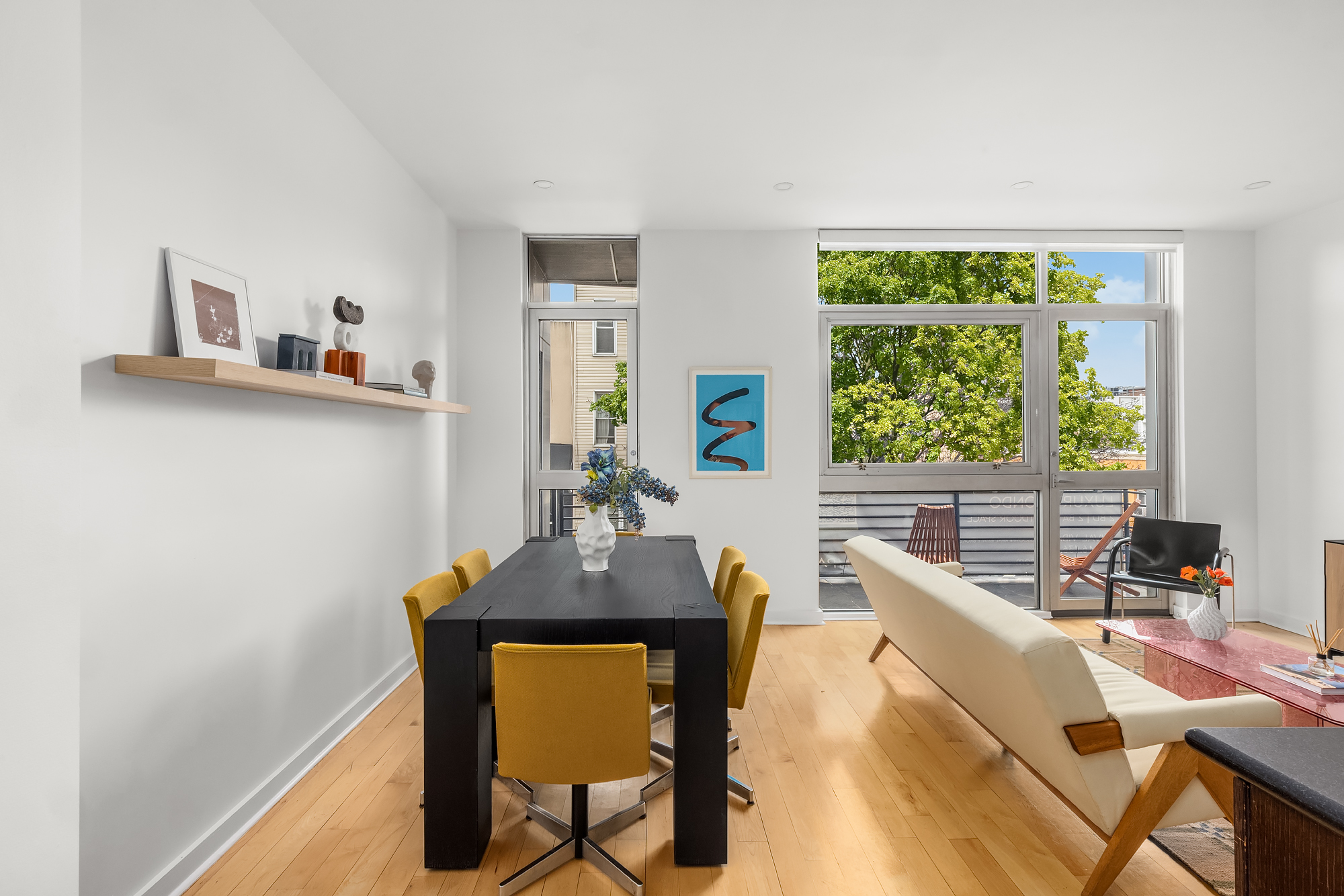 82 Guernsey Street, Unit 2A Brooklyn, NY 11222 - Photo 5 of 16 a view of a dining room with furniture and a potted plant