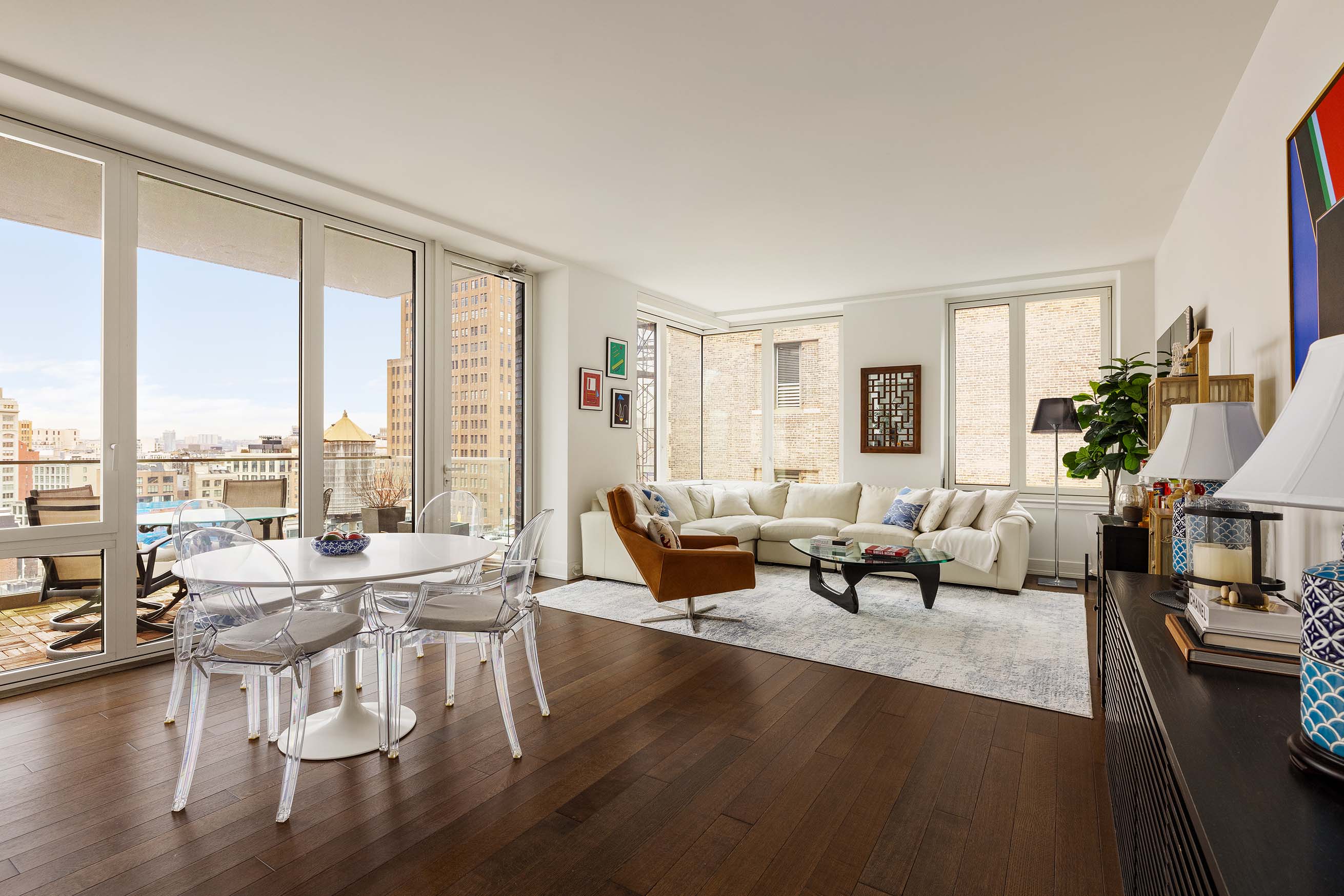 5 Franklin Place, Unit 14A Manhattan, NY 10013 - Photo 2 of 23 a living room with furniture and a large window