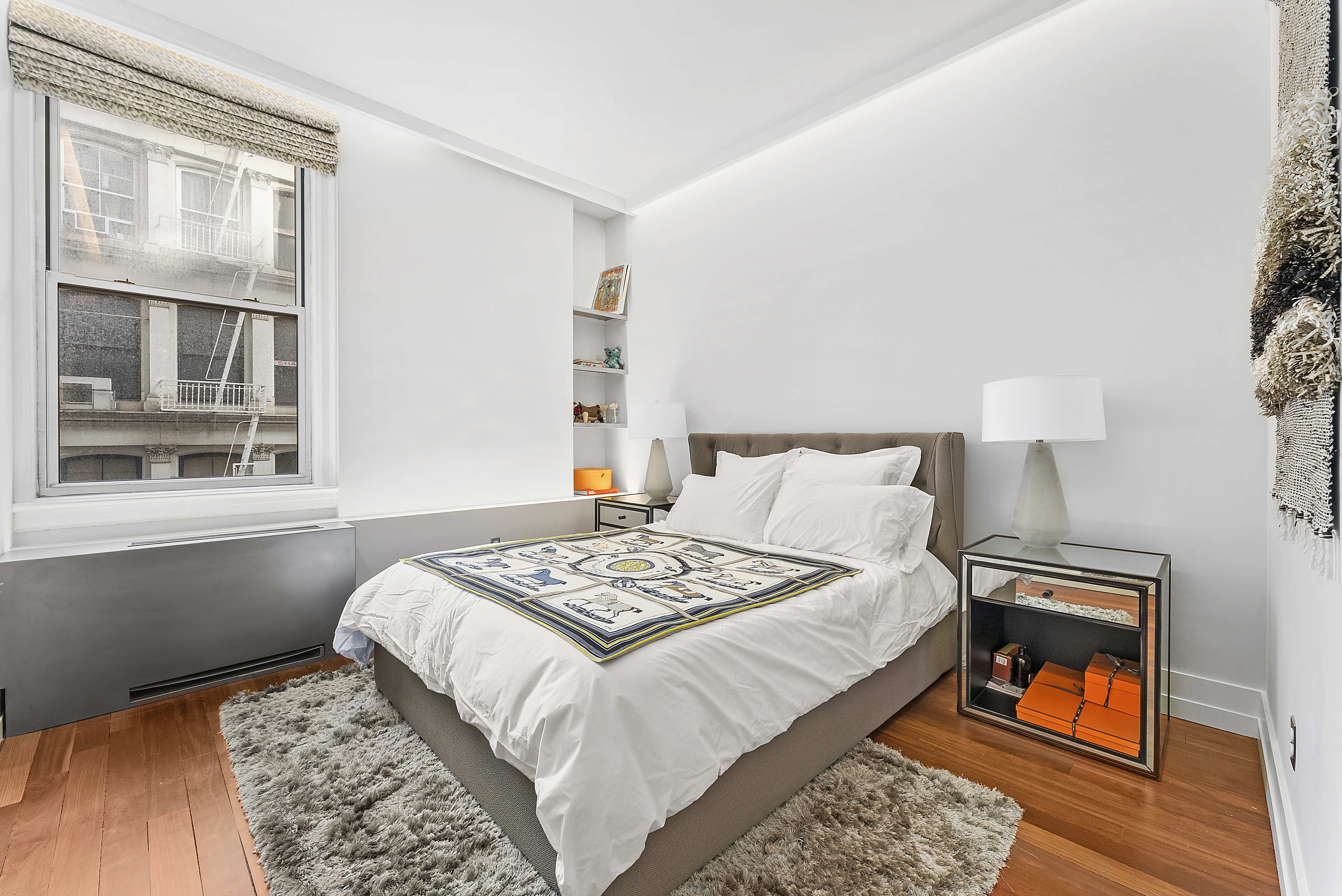 66 Leonard Street, Unit 2A Manhattan, NY 10013 - Photo 13 of 15 a bedroom with a bed and a window