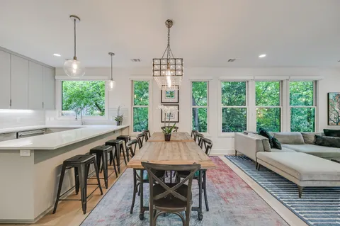 a view of a dining room with furniture window and outside view