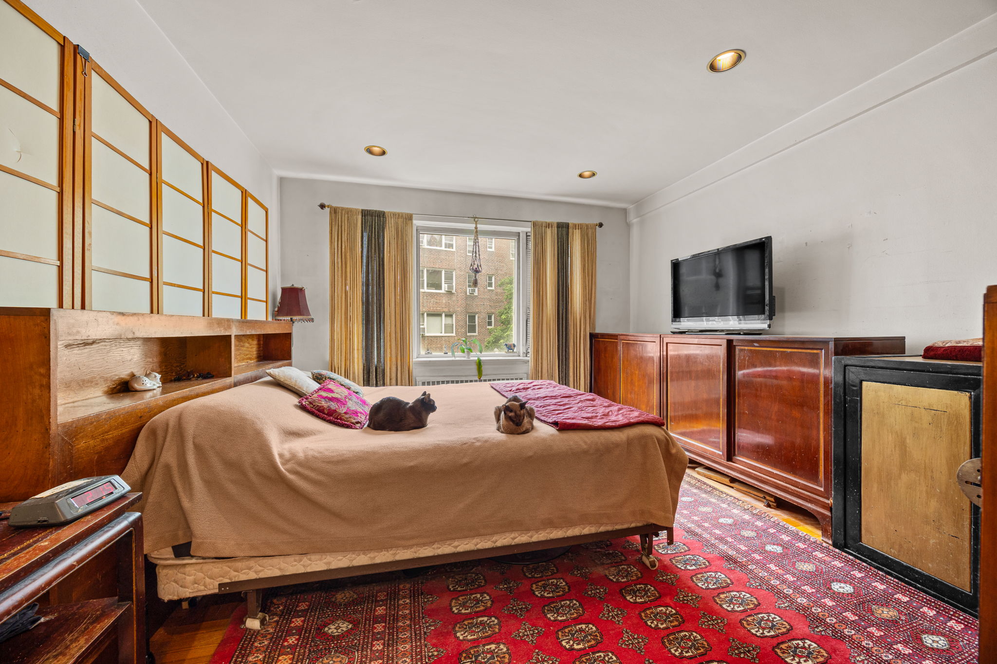 3850 Hudson Manor Terrace, Unit 1EE/2EE Bronx, NY 10463 - Photo 14 of 27 a bedroom with a bed and wooden floor