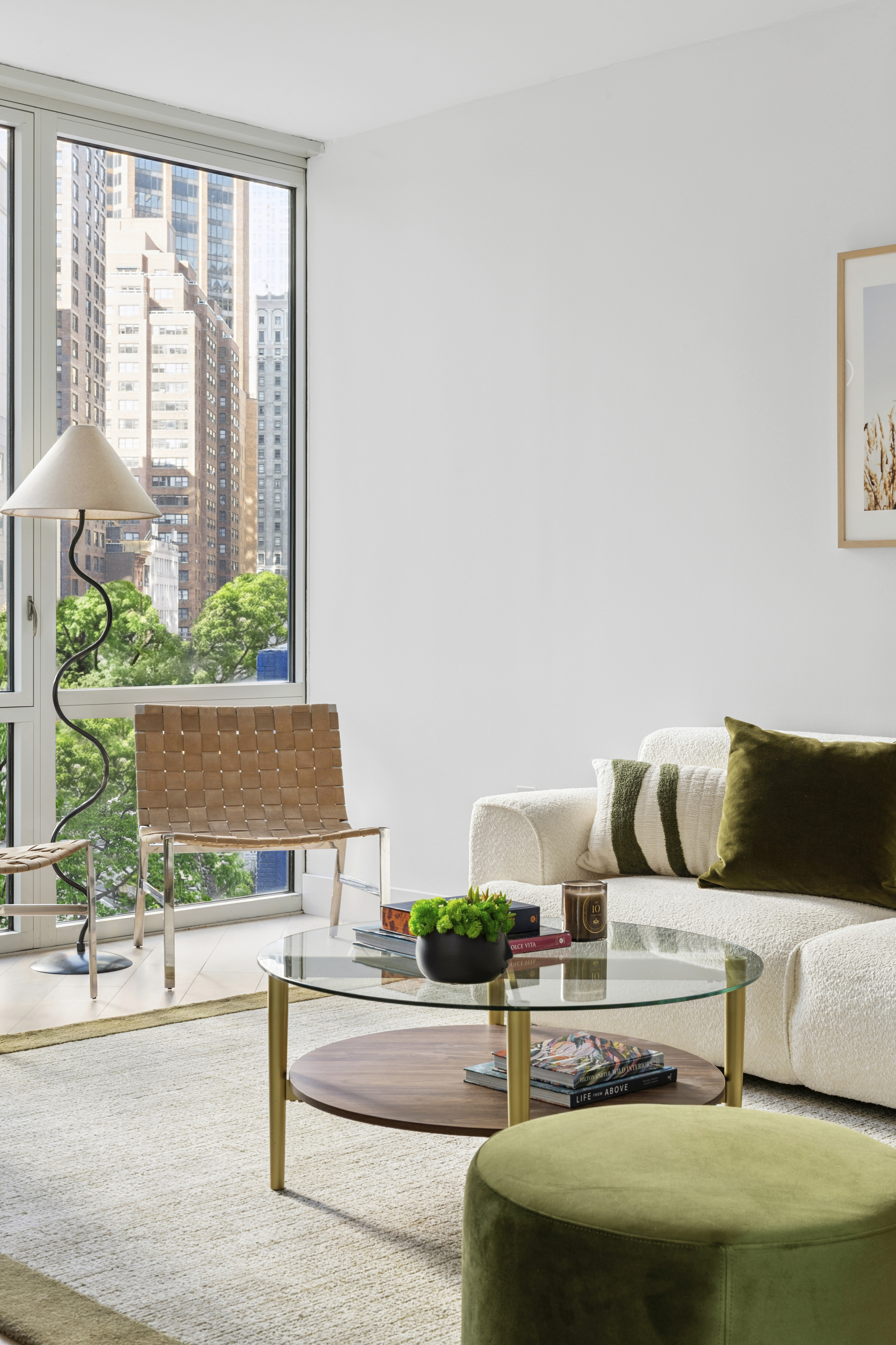 225 East 34th Street, Unit 5E Manhattan, NY 10016 - Photo 5 of 23 a living room with a couch and a window