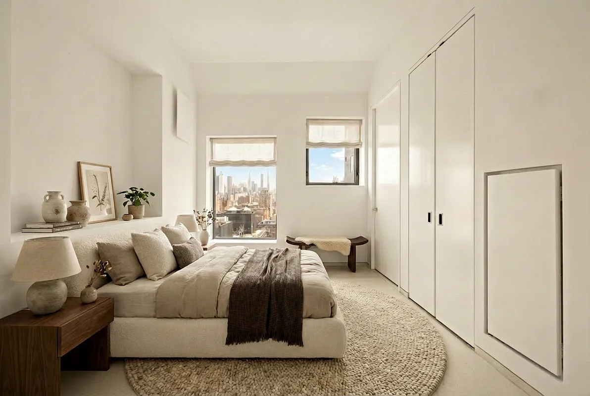 100 11th Avenue, Unit 16A Manhattan, NY 10011 - Photo 10 of 17 a spacious bedroom with a bed and a couch
