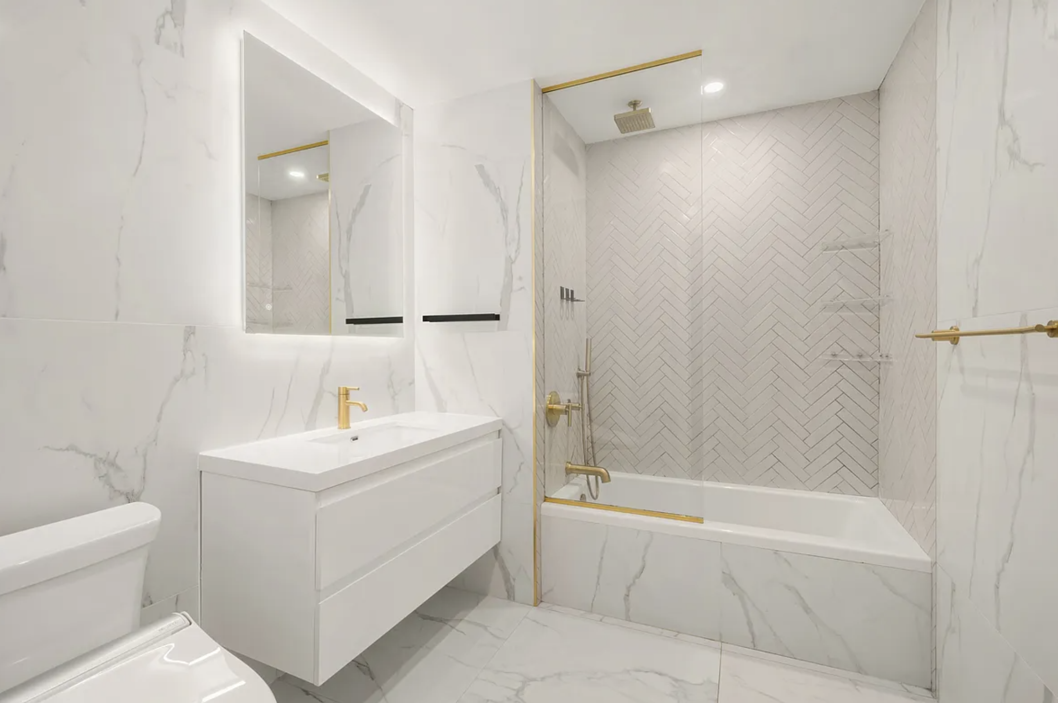 17 West 24th Street, Unit 4 Manhattan, NY 10010 - Photo 6 of 8 a bathroom with a sink a toilet and shower