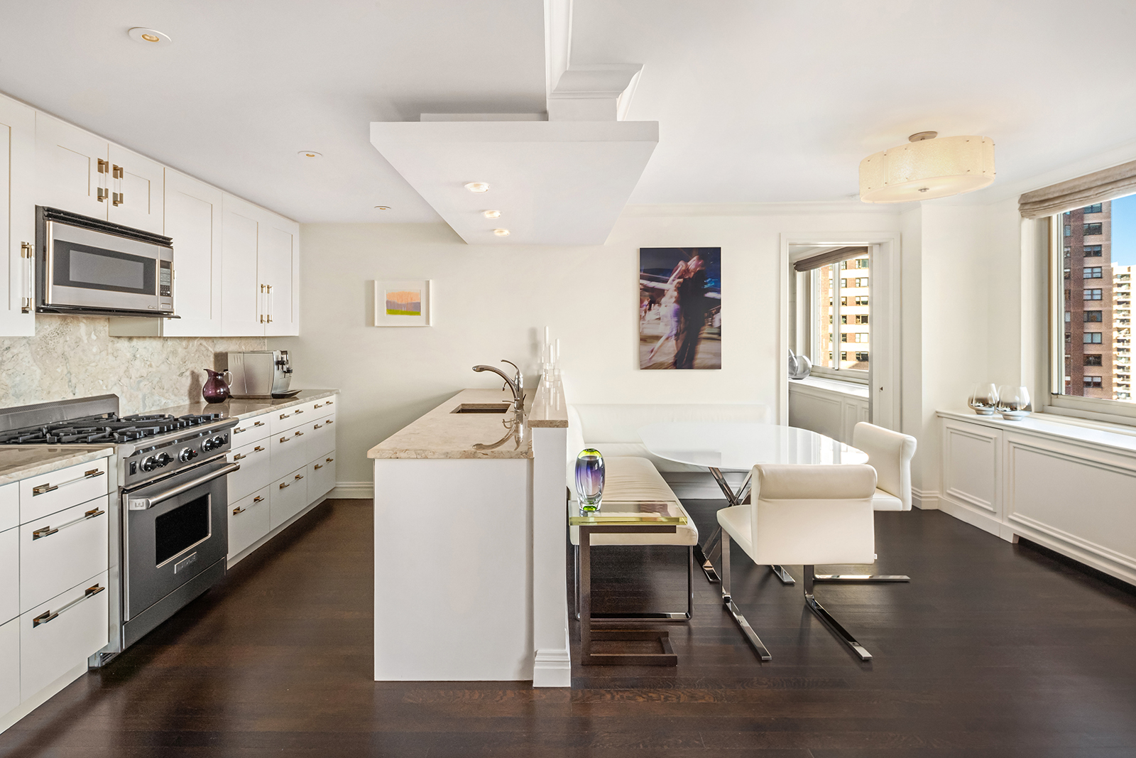 30 West 63rd Street, Unit 26VW Manhattan, NY 10023 - Photo 4 of 20 a kitchen that has a lot of cabinets in it and appliances