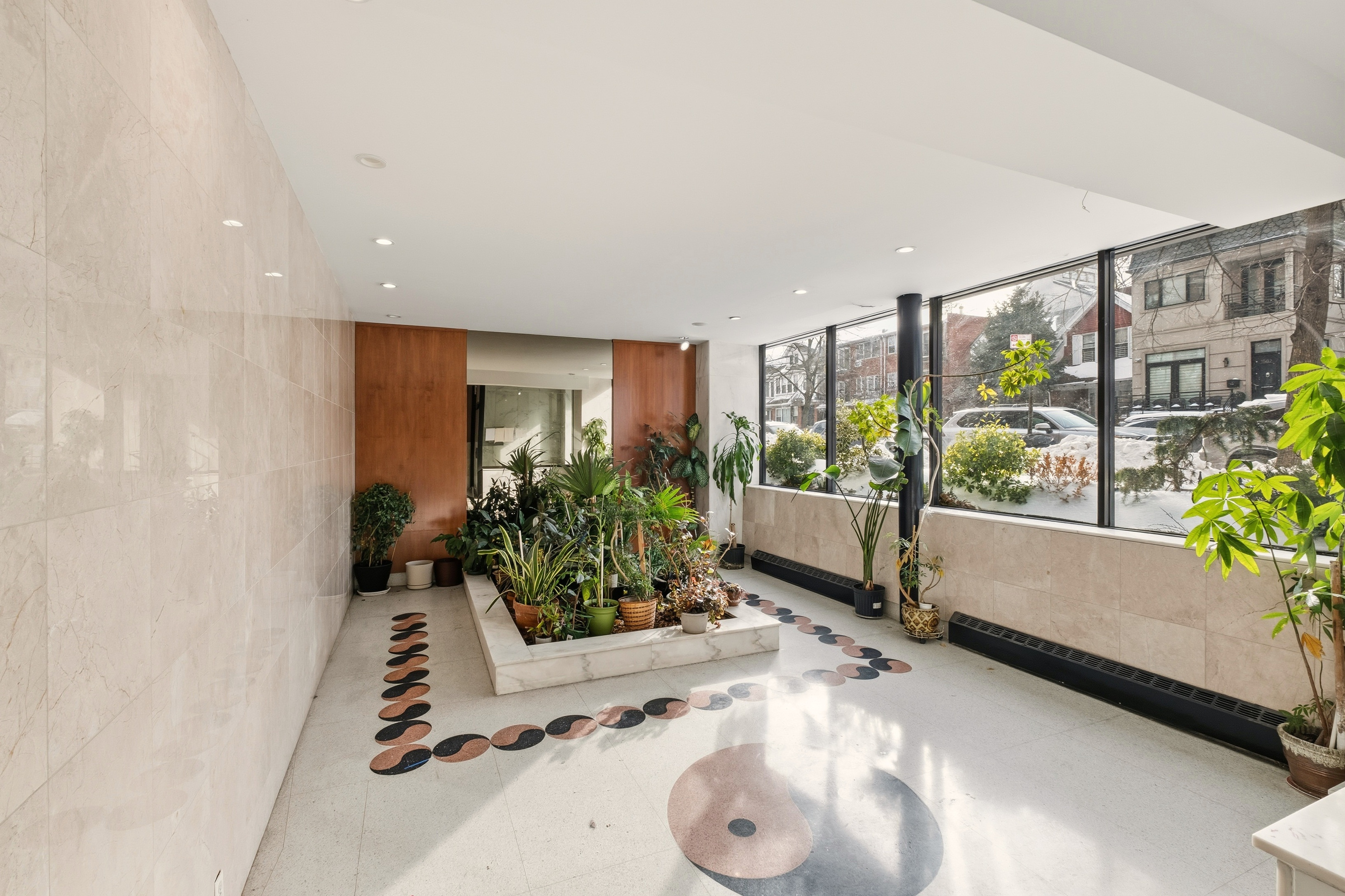 1577 East 17th Street, Unit 2F Brooklyn, NY 11230 - Photo 15 of 21 a living room with furniture and a large window
