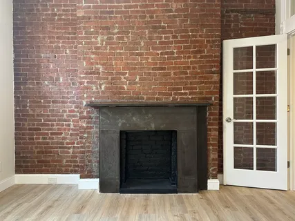 a view of front door of house with wooden floor