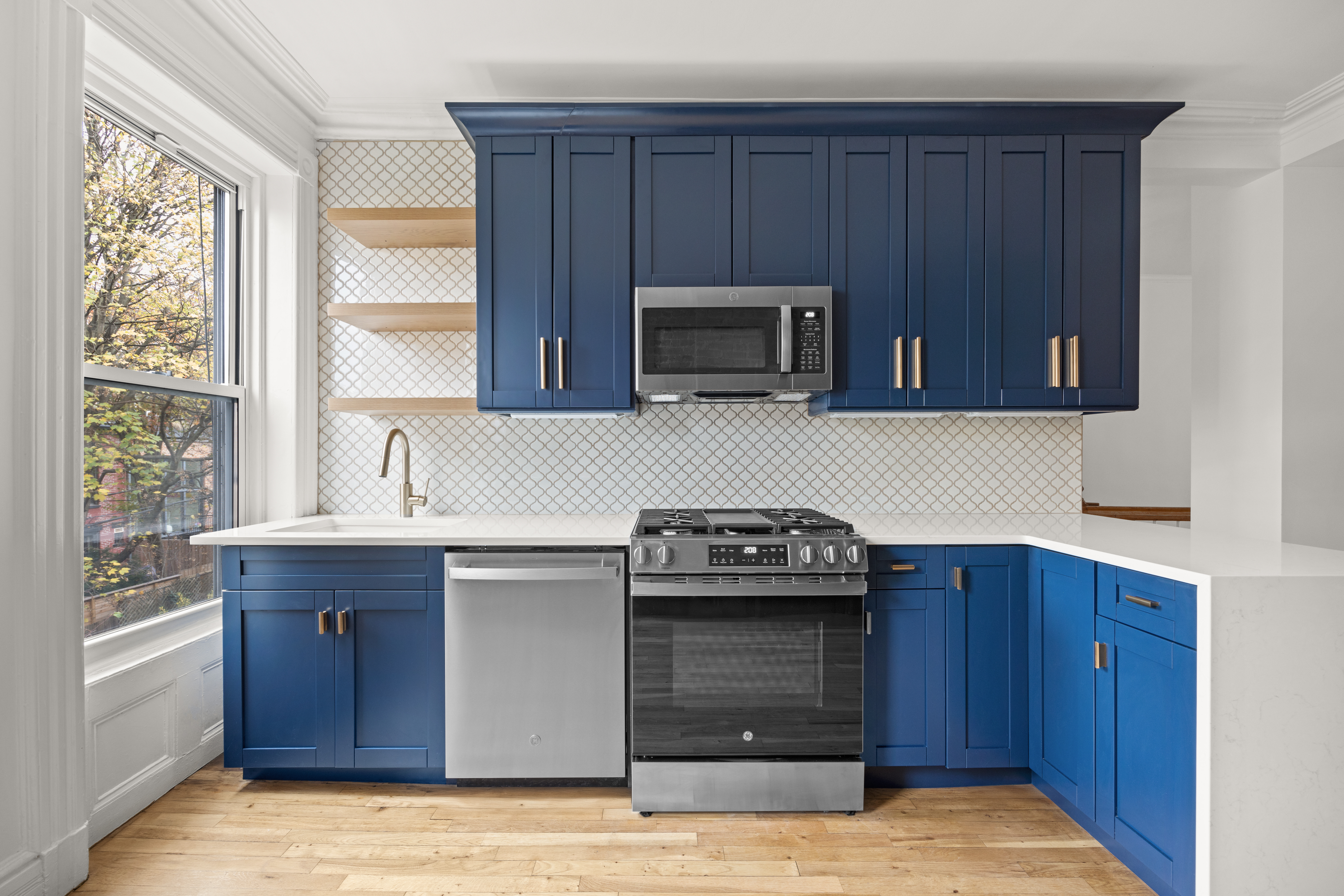 485 1st Street, Unit 2 Brooklyn, NY 11215 - Photo 5 of 17 a kitchen with a stove and a microwave