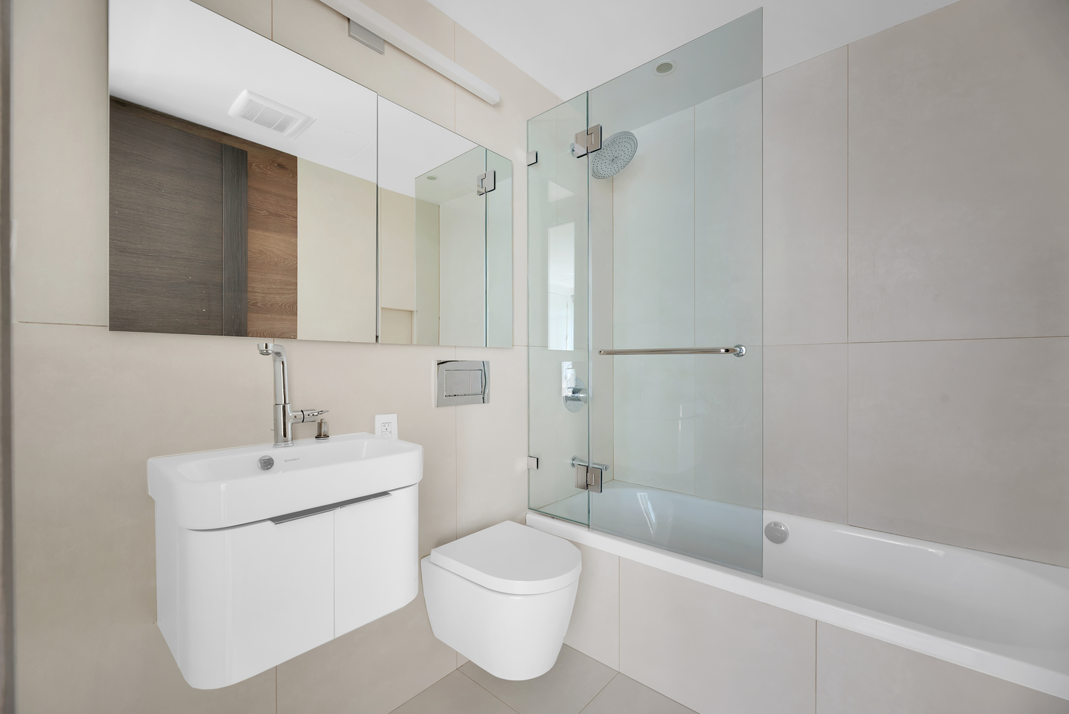 440 West 20th Street Manhattan, NY 10011 - Photo 16 of 35 a bathroom with a white toilet sitting next to a bathroom sink and a shower
