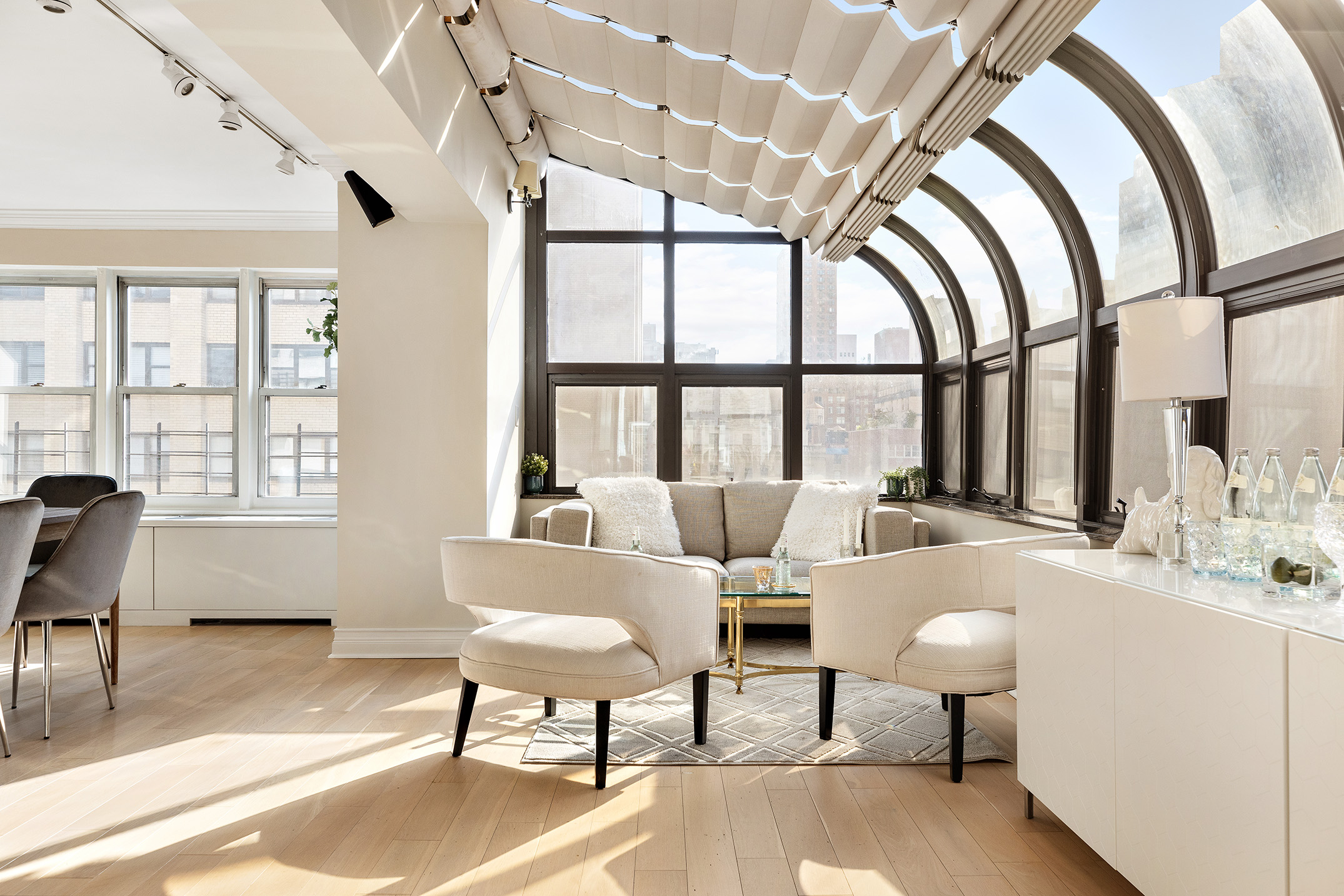 155 East 38th Street, Unit 12K Manhattan, NY 10016 - Photo 4 of 15 a living room with furniture and a large window