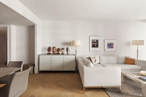 a living room with furniture and a couch