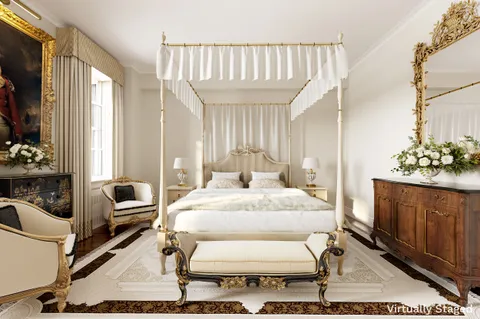 a bedroom with furniture and wooden floor