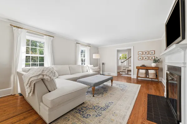 a living room with furniture and a flat screen tv