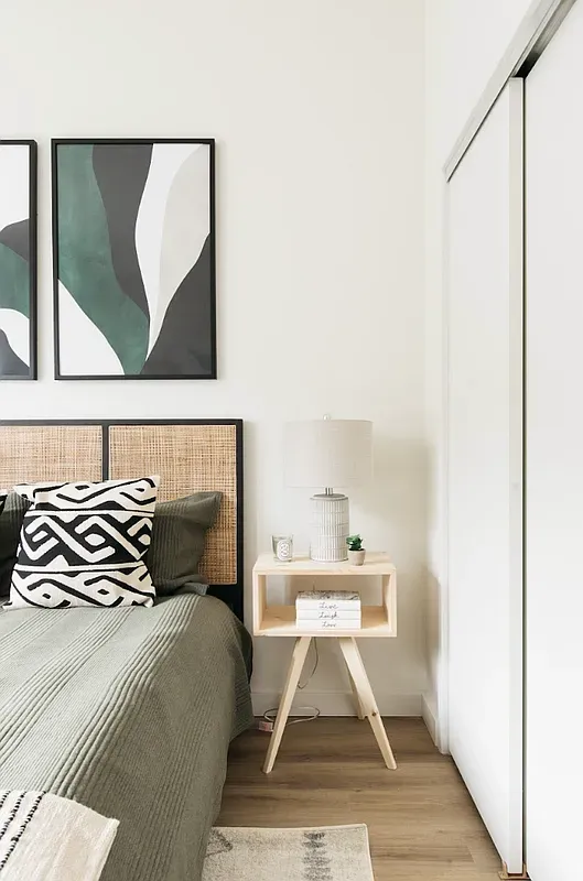 a bedroom with a bed and window