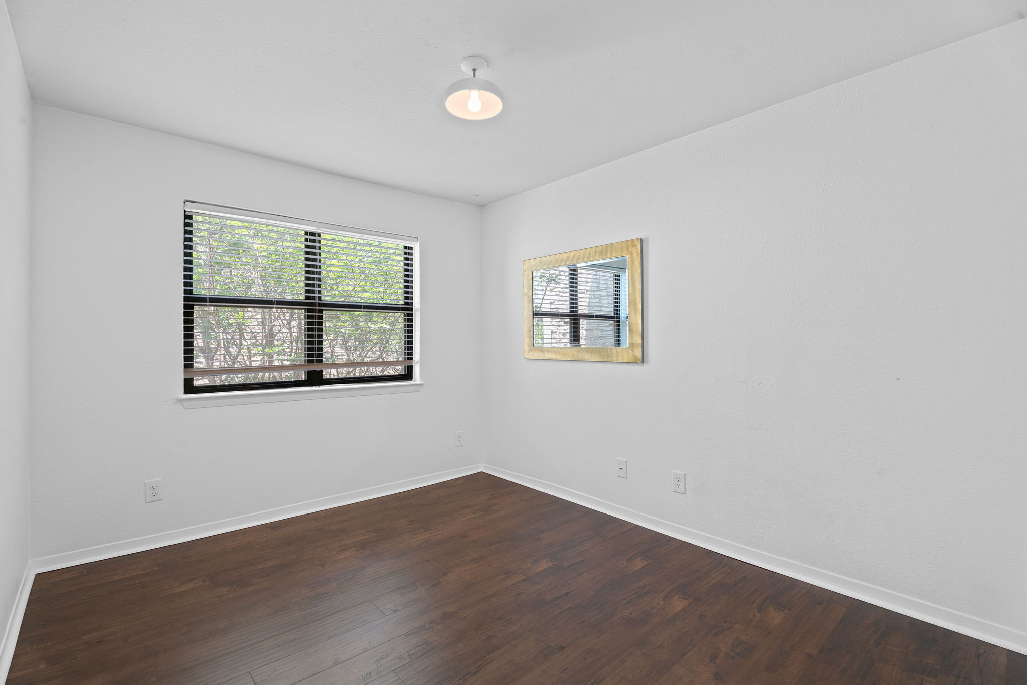 1510 West N Loop Boulevard, Unit 424 Austin, TX 78756 - Photo 22 of 25 an empty room with windows
