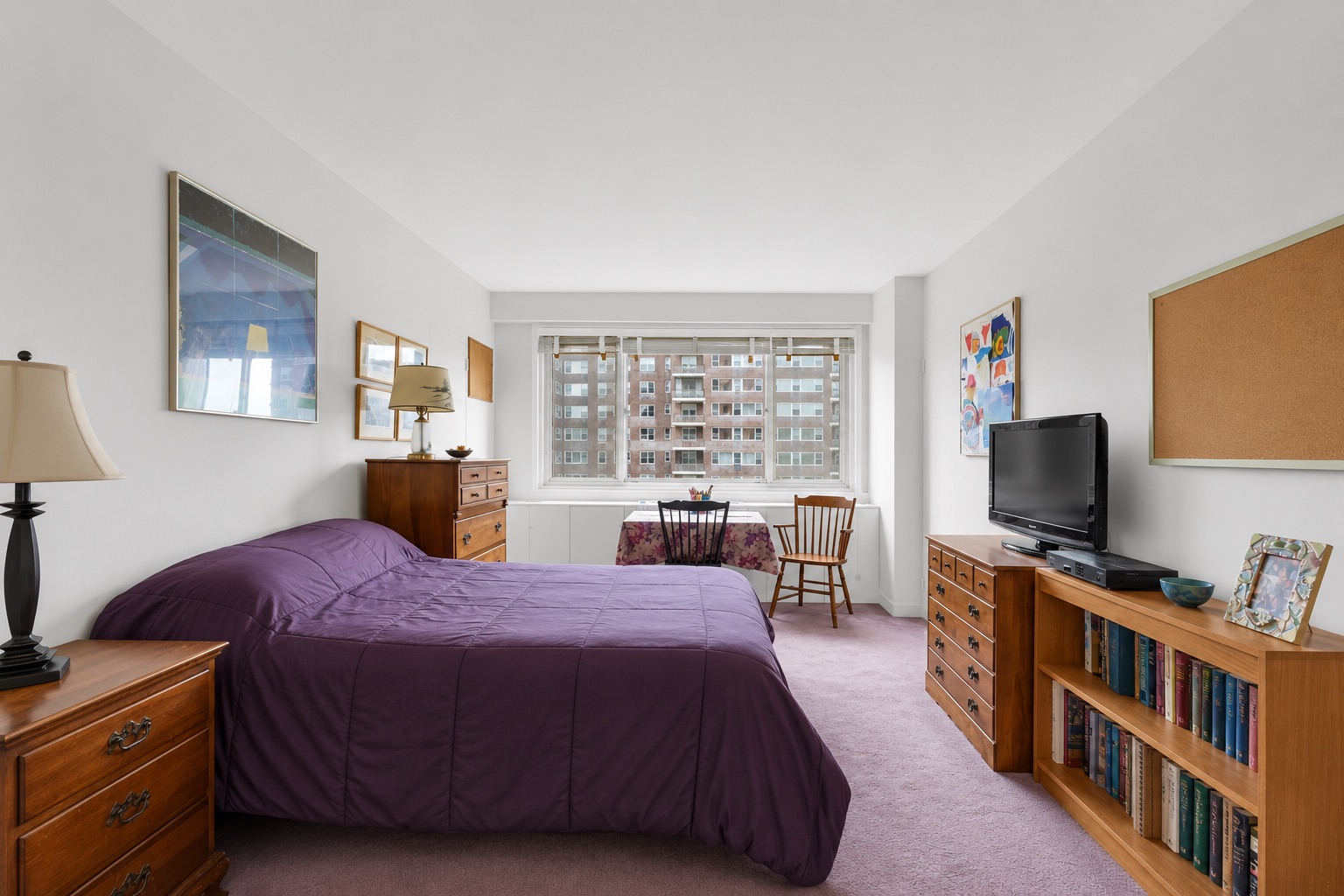 2621 Palisade Avenue, Unit 11J Bronx, NY 10463 - Photo 13 of 19 a bedroom with a bed and a flat screen tv
