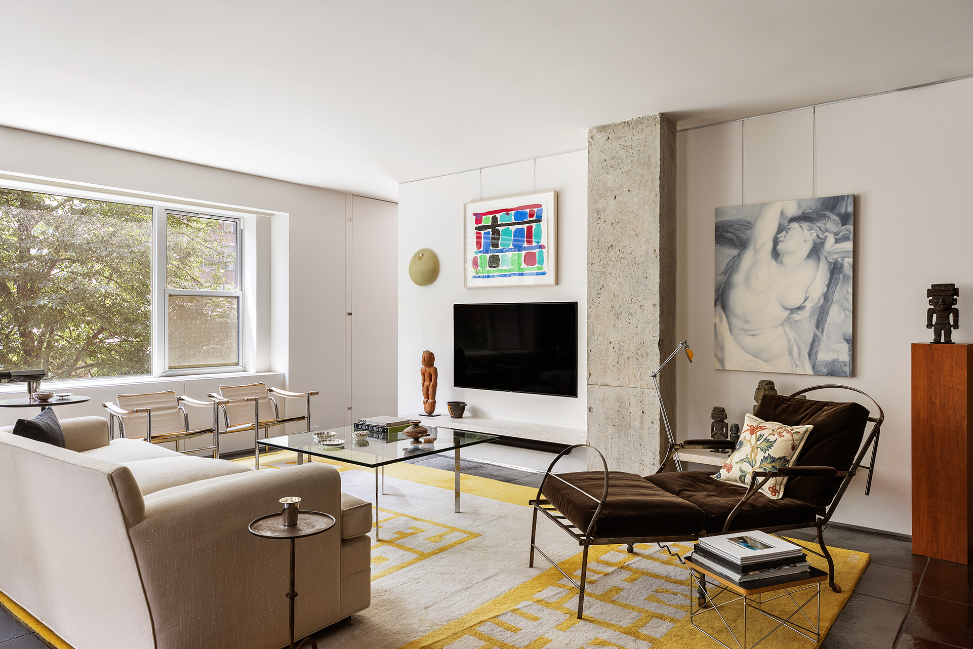 a living room with furniture and a flat screen tv